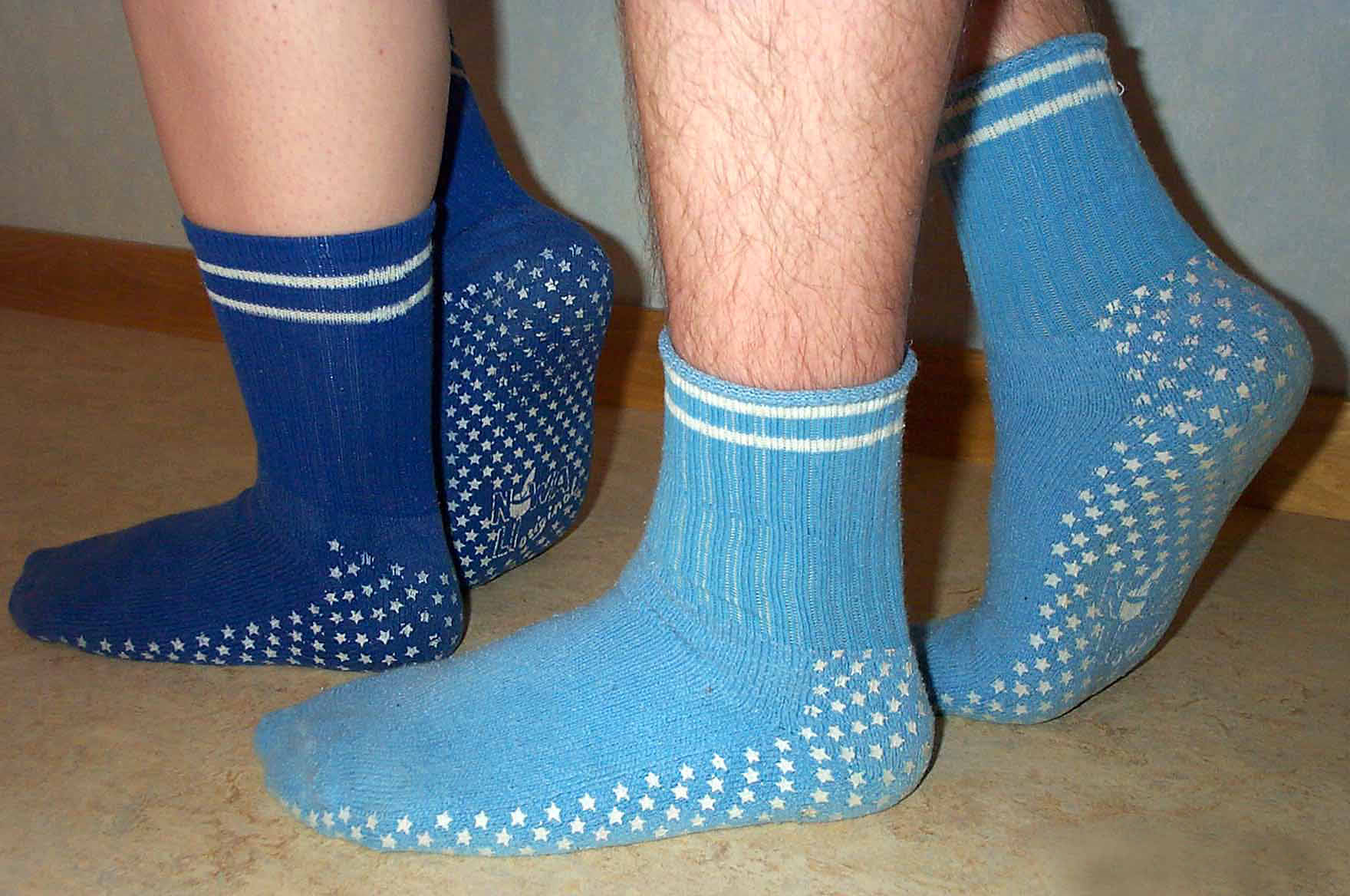 Non-skid socks provide crucial friction between the patient's feet and smooth hospital floors, significantly reducing the risk of a dangerous fall.
