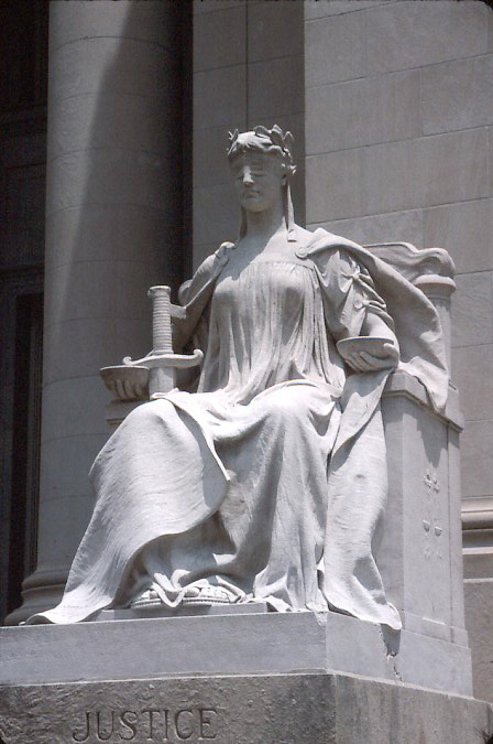 Lady Justice, the traditional symbol of impartial adjudication — the ideal that security of tenure and judicial immunity are designed to protect in practice.