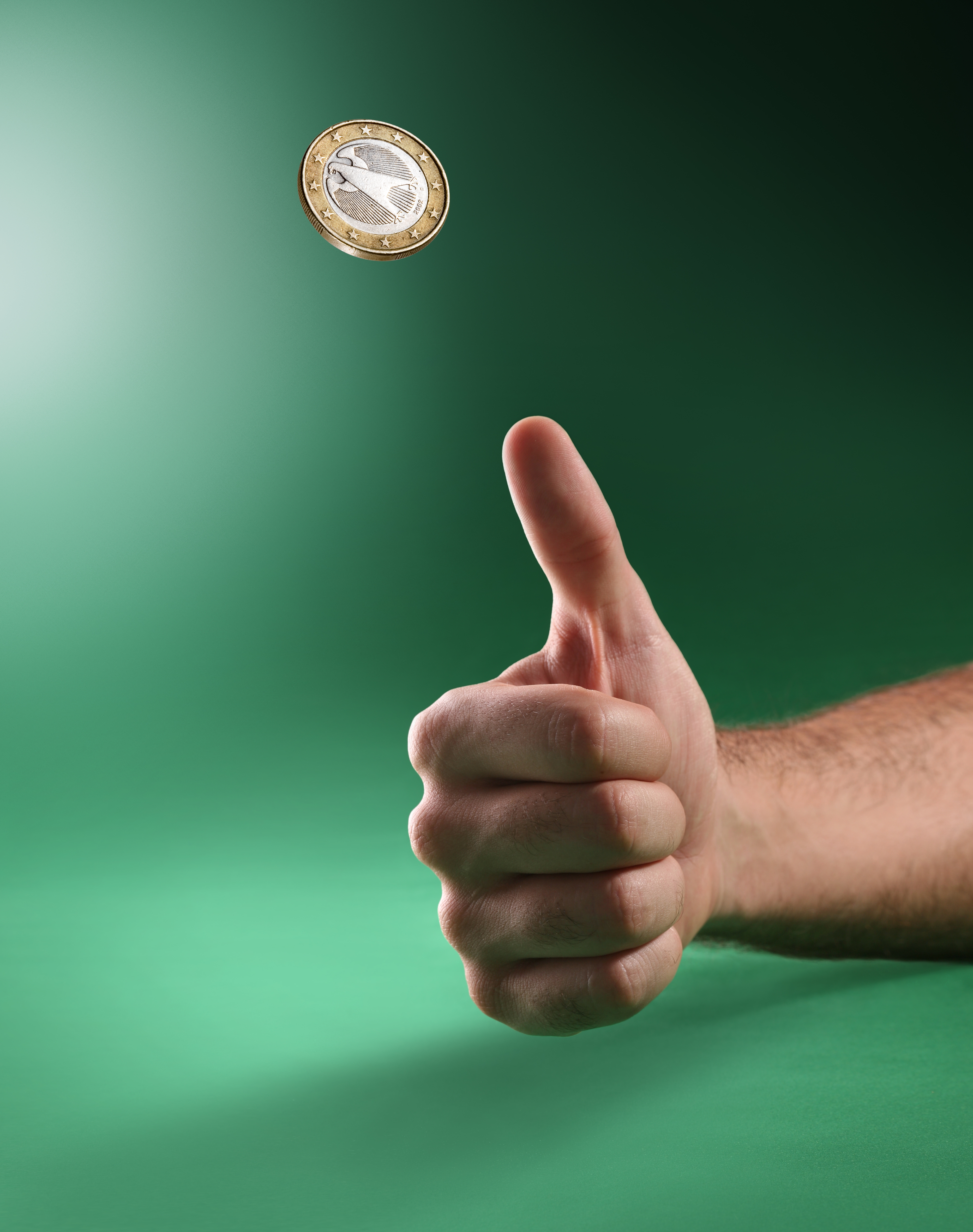A coin tossed in mid-air. Because physical conditions reset and the coin cannot remember its previous flips, each individual toss is a completely independent event.