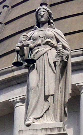 A statue of Lady Justice, demonstrating the personification of an abstract concept through human characteristics, such as a blindfold representing impartiality.
