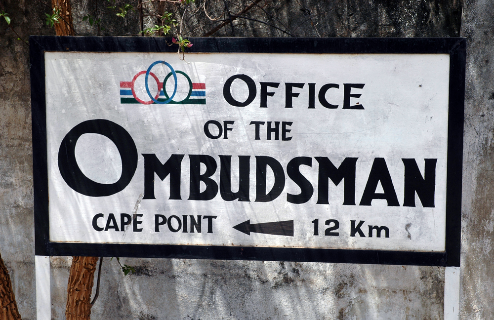 A sign directing people to an ombudsman's office — ombudsman schemes give consumers a free, informal route to resolve complaints against regulated businesses without going to court.