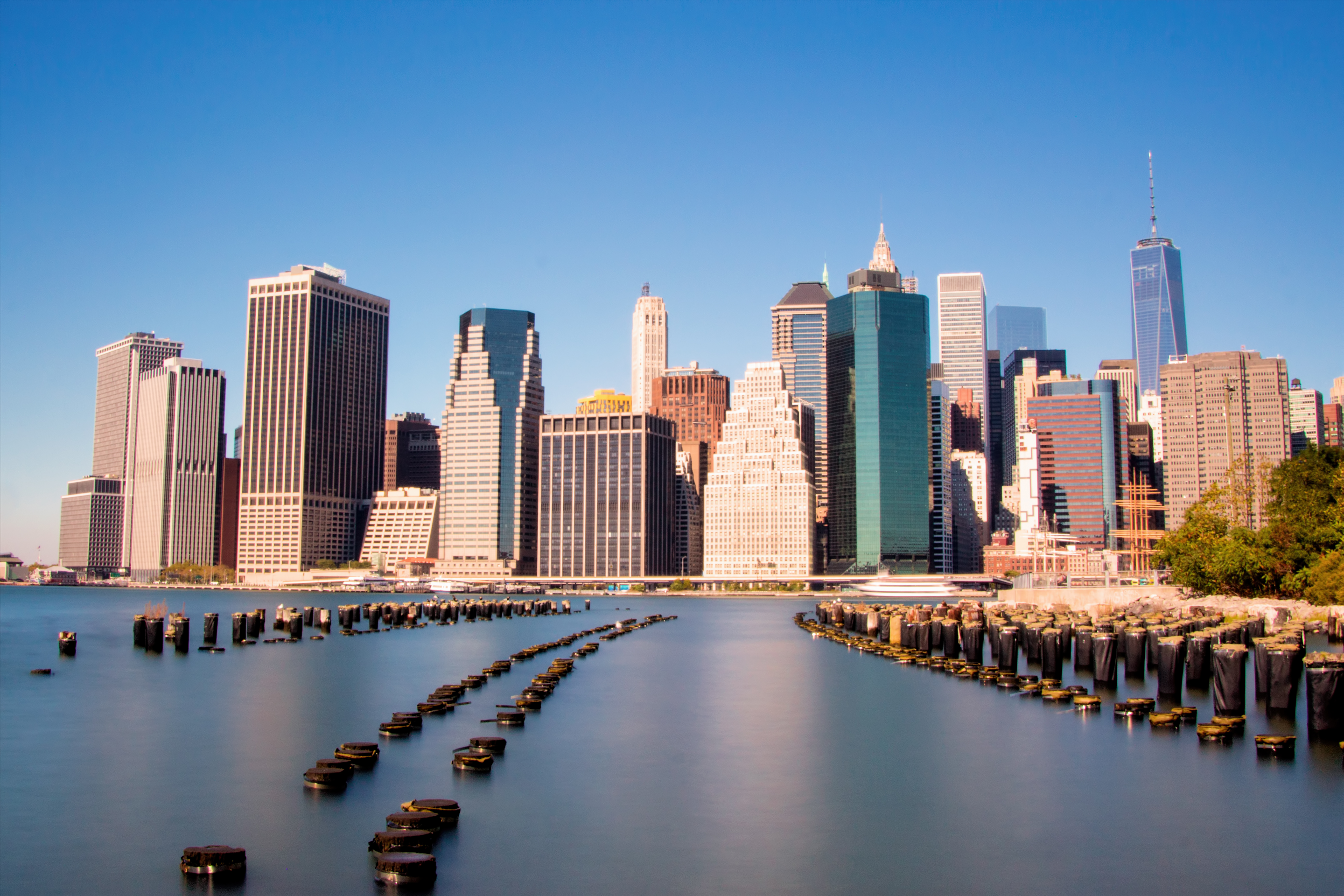Institutional-grade real estate, such as the commercial skyscrapers in Manhattan's Financial District, requires massive capital that is generally out of reach for individual retail investors.