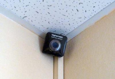 A security camera serves as a strong visual metaphor for the third-person objective point of view, which records external actions and dialogue without accessing a character's internal thoughts.