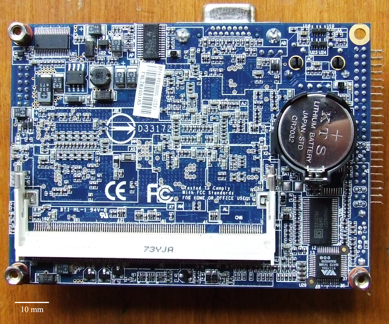 A CMOS battery seated on a computer motherboard. If this battery fails, the hardware system clock resets to factory defaults, causing widespread cryptographic certificate validation errors due to incorrect timestamps.