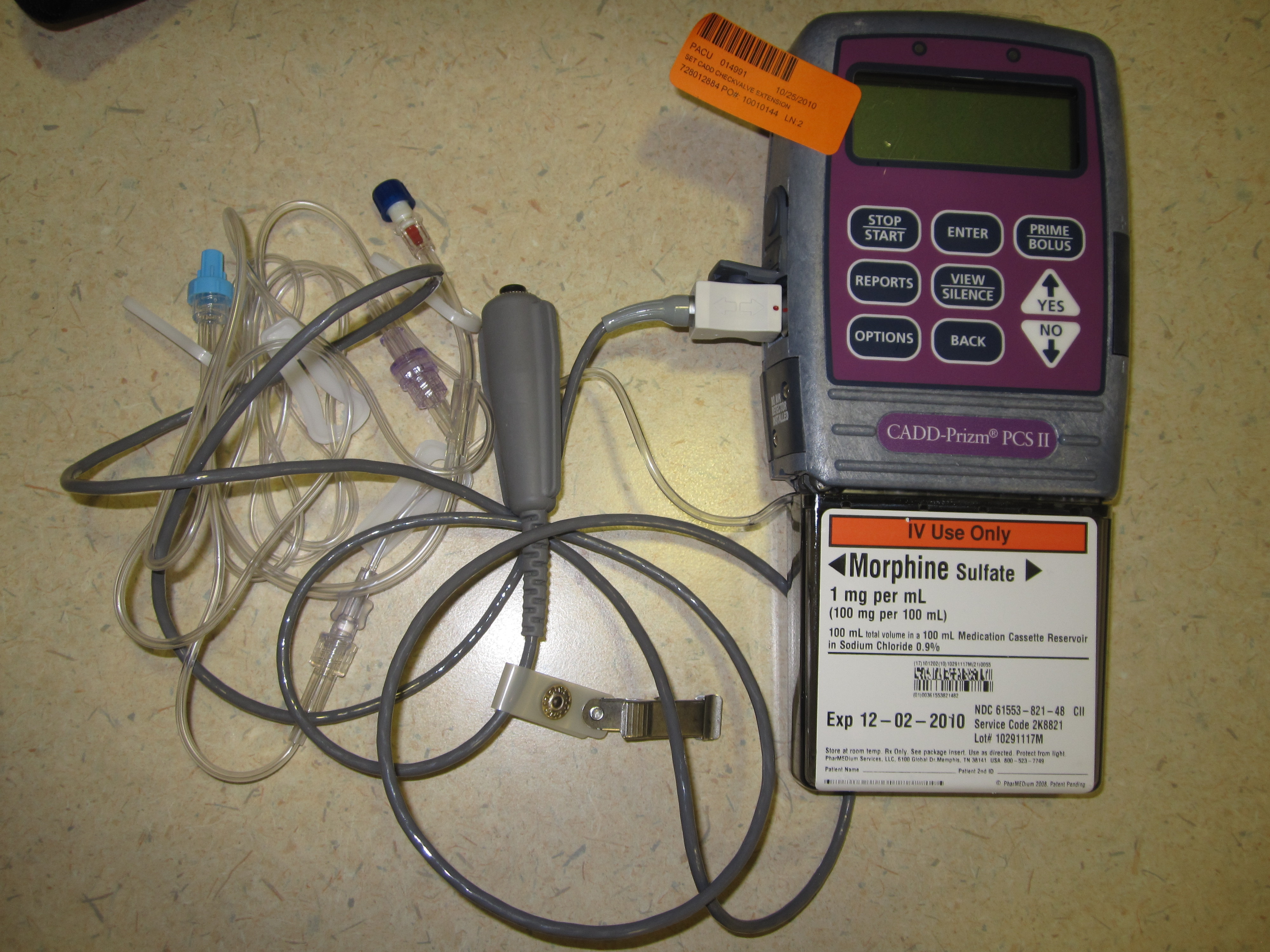 A patient-controlled analgesia (PCA) pump configured for intravenous administration. Due to the severe risk of a fatal narcotic overdose, programming this device mandates an independent double-check by two registered nurses.