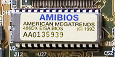 A ROM BIOS chip on a motherboard. Vulnerabilities residing in this low-level firmware bypass operating system controls, making them uniquely dangerous and difficult to detect.