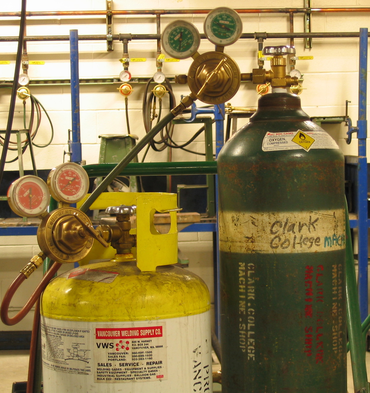Highly pressurized oxygen cylinders must be securely stored in upright stands to prevent the valves from breaking off and turning the tanks into dangerous projectiles.