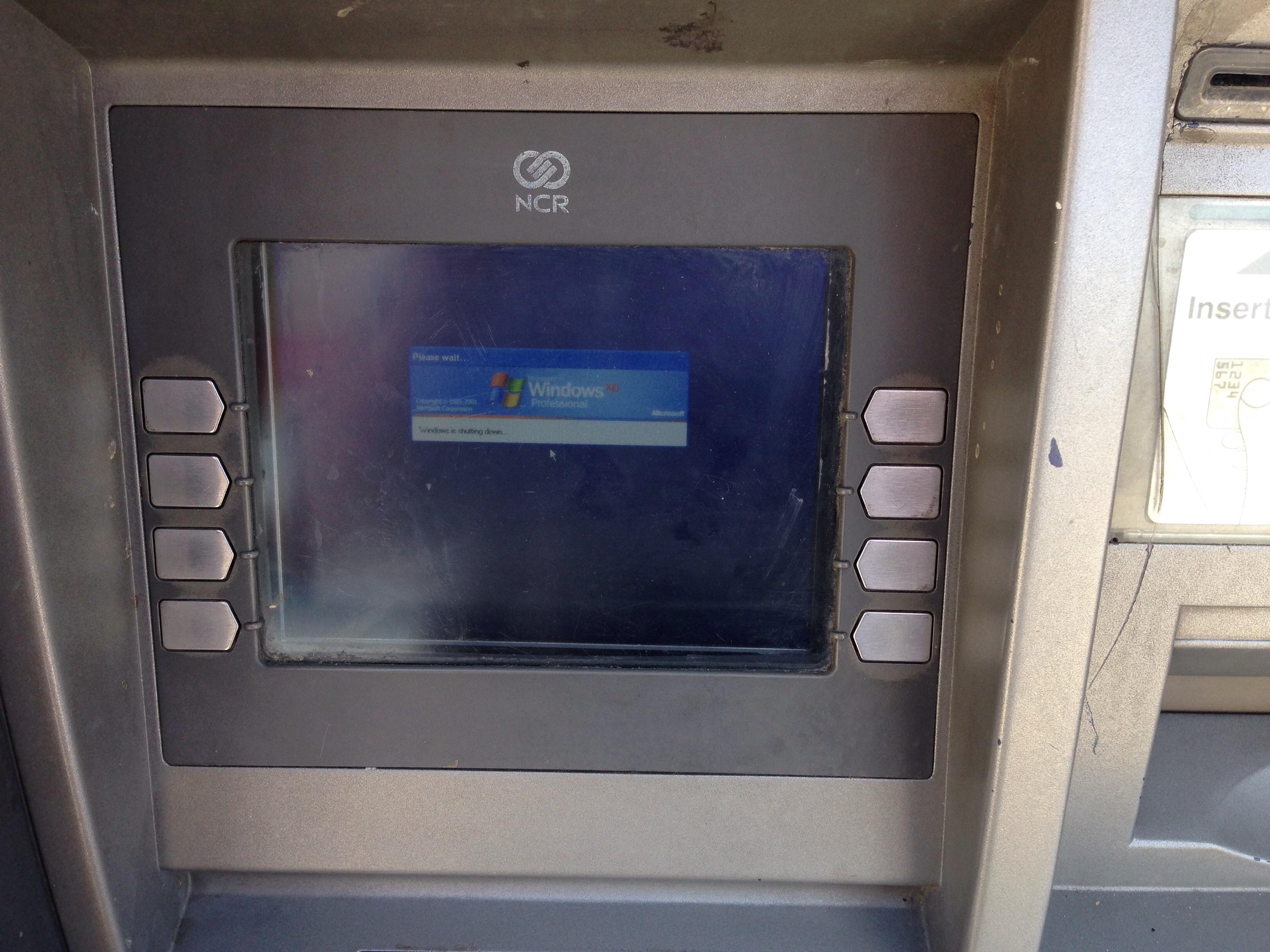 An ATM running the unsupported Windows XP operating system in 2018. Organizations frequently maintain highly vulnerable legacy systems in production because they perform specialized or critical business functions.