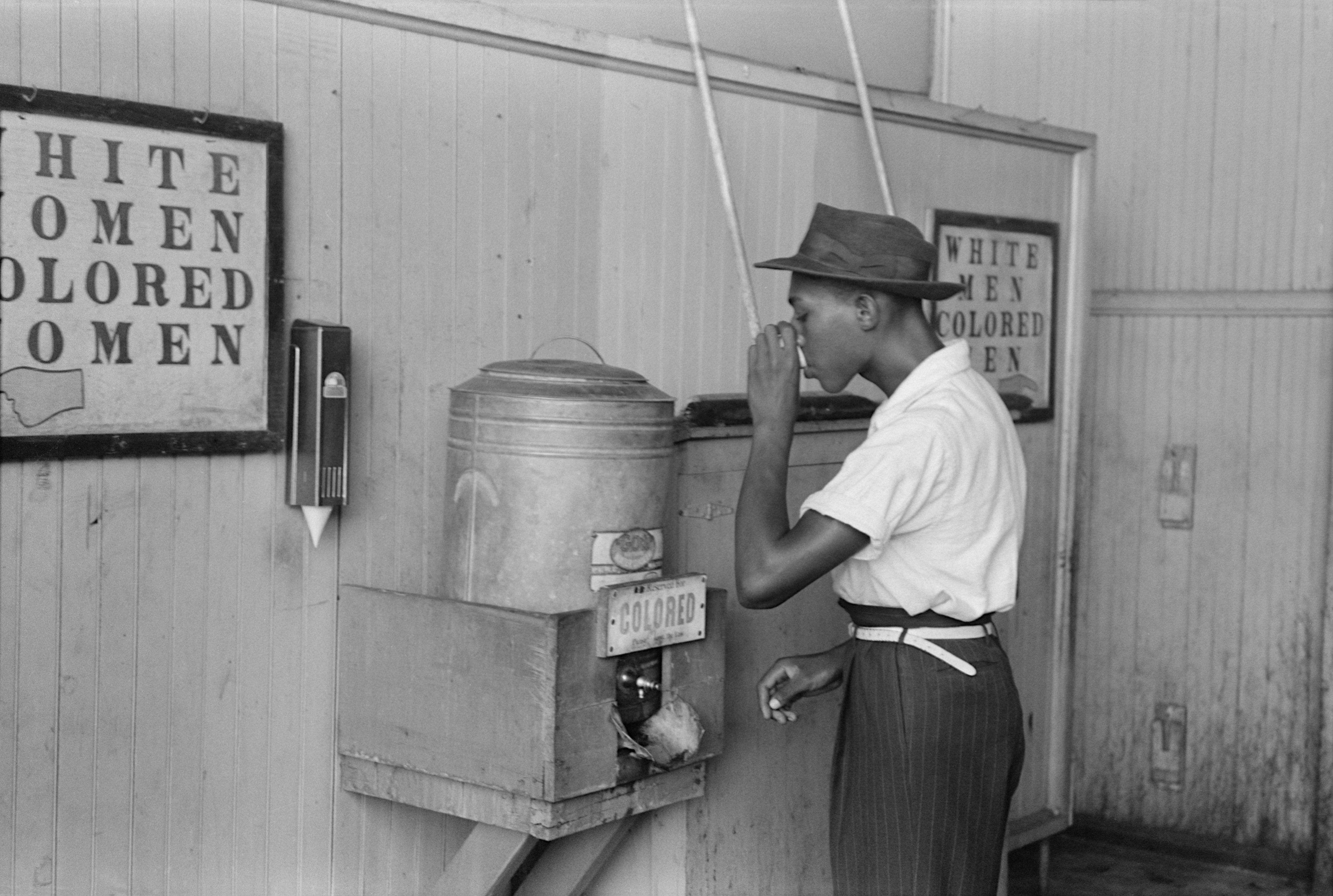 A segregated water cooler in Oklahoma City in 1939. For decades, the "separate but equal" doctrine established in Plessy v. Ferguson provided legal cover for systemic, government-enforced discrimination.