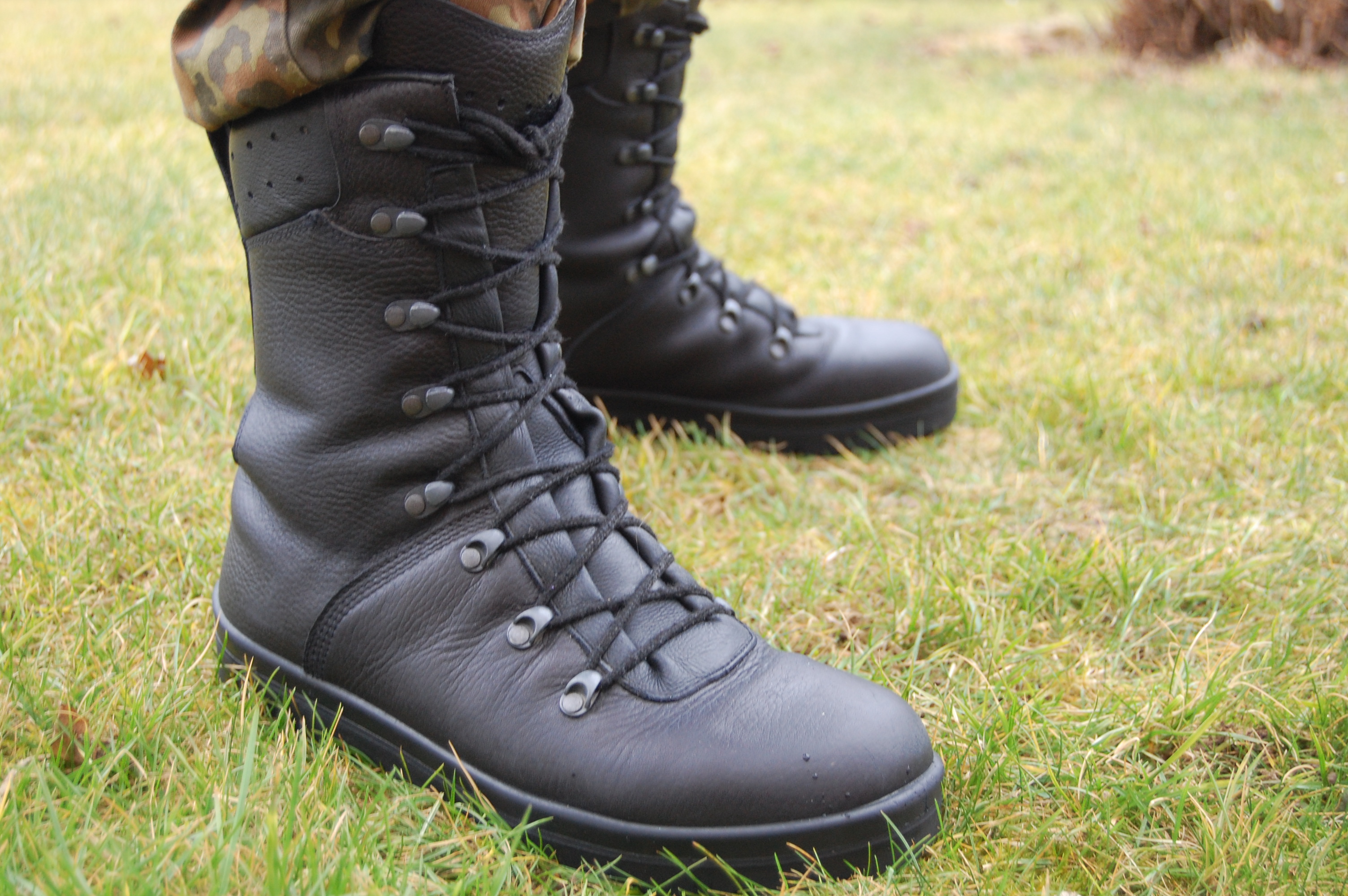 A visual example of synecdoche: using a physical part, such as military boots, to represent the entirety of the soldiers wearing them (e.g., "boots on the ground").
