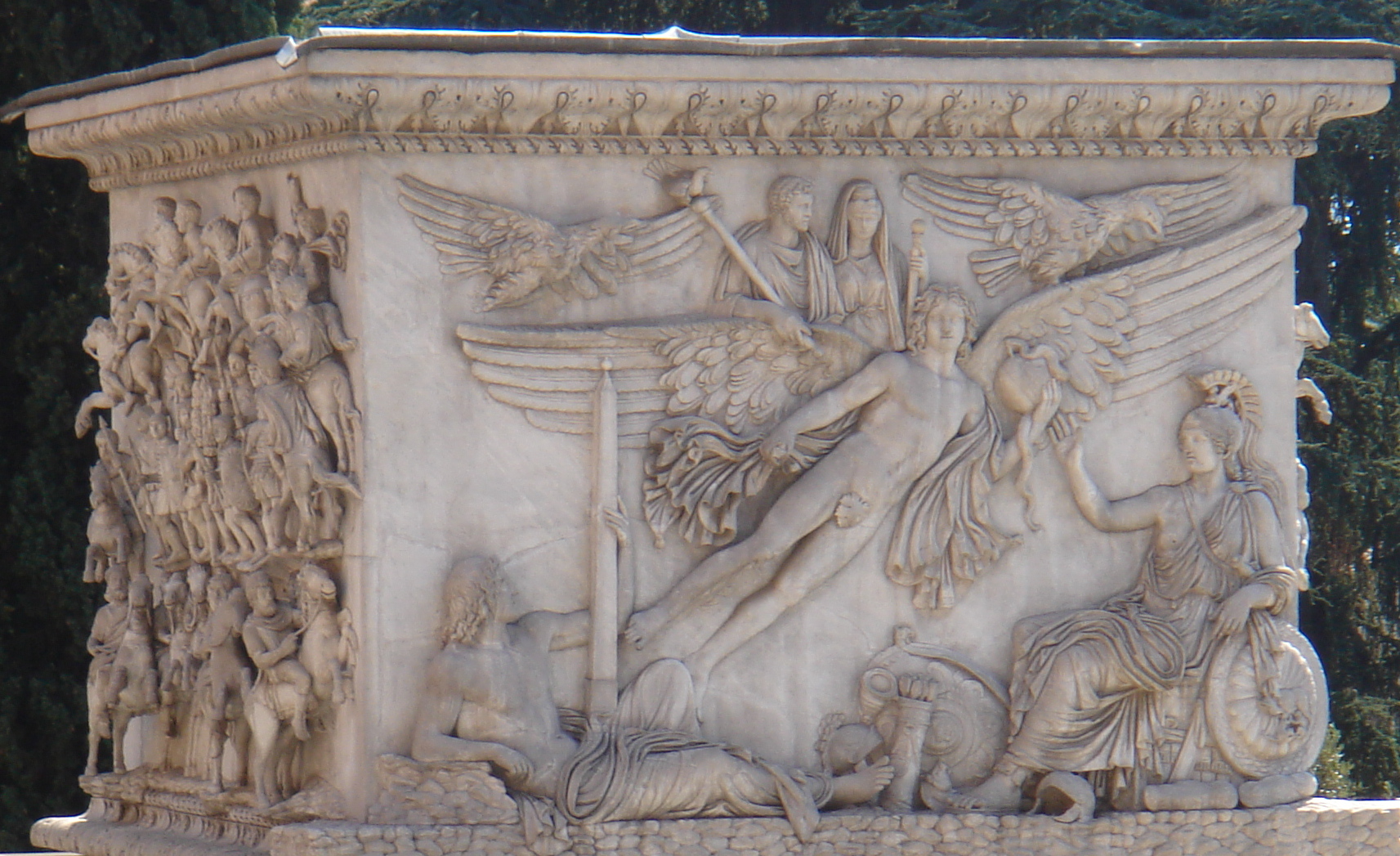 A classical relief depicting the apotheosis of a Roman emperor, visually representing the concept defined by the sentence's internal context clues: elevation to divine status.