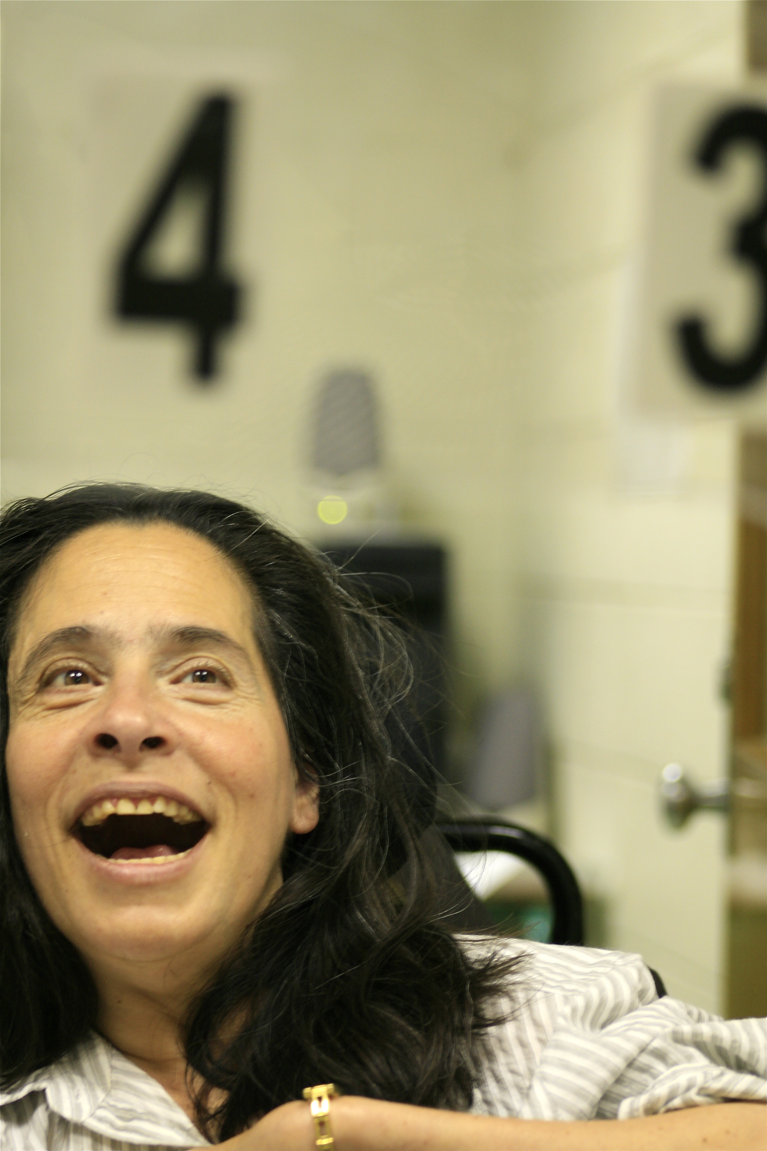 A student utilizing an eye-gaze communication board. SLPs are instrumental in assessing for and implementing Augmentative and Alternative Communication (AAC) systems.