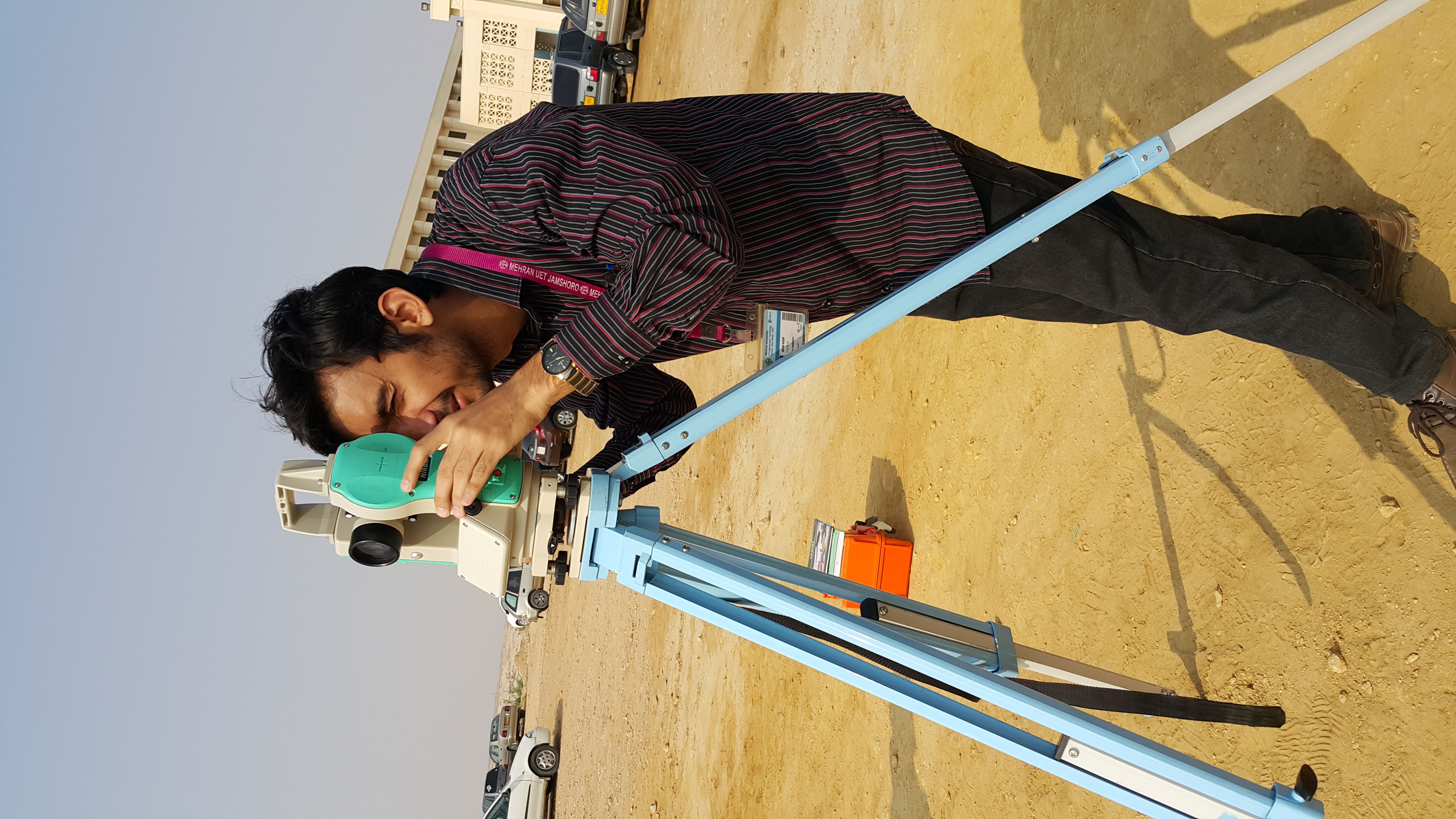 Surveyors use precise instruments like a theodolite alongside mathematical reasoning to measure distant angles and lengths in the field.