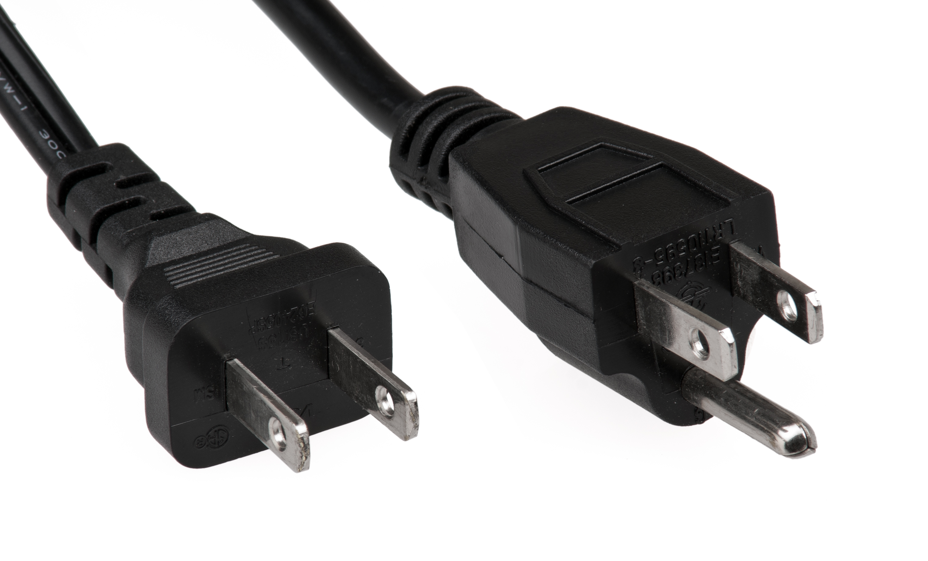 A comparison of an ungrounded plug (left) and a grounded plug with a third prong (right). The third prong connects to a grounding wire, safely diverting rogue electrical currents away from the patient and into the earth.