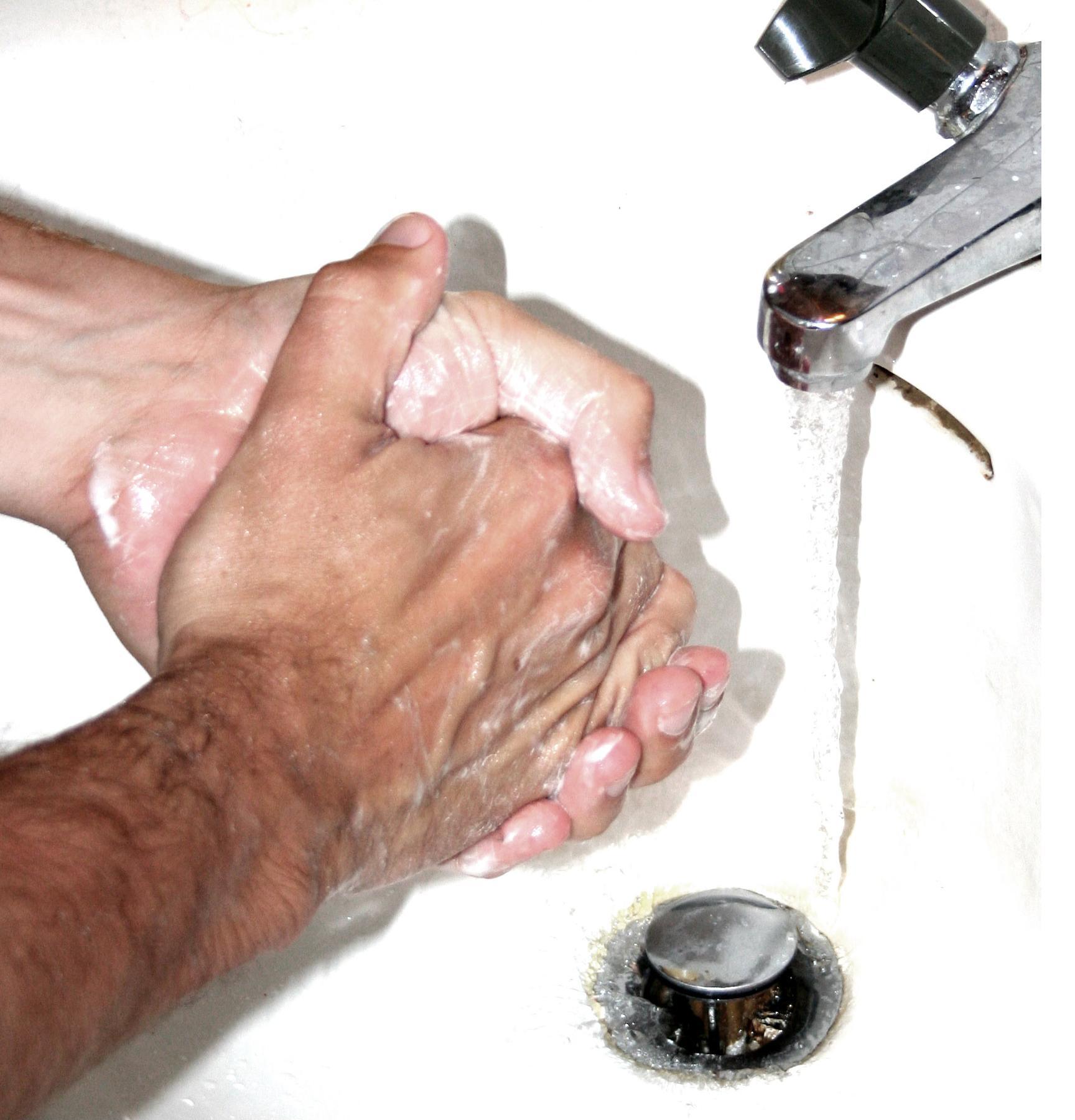 Excessive and repetitive handwashing is a classic physical compulsion performed to temporarily alleviate the intense psychological anxiety triggered by an intrusive obsession.