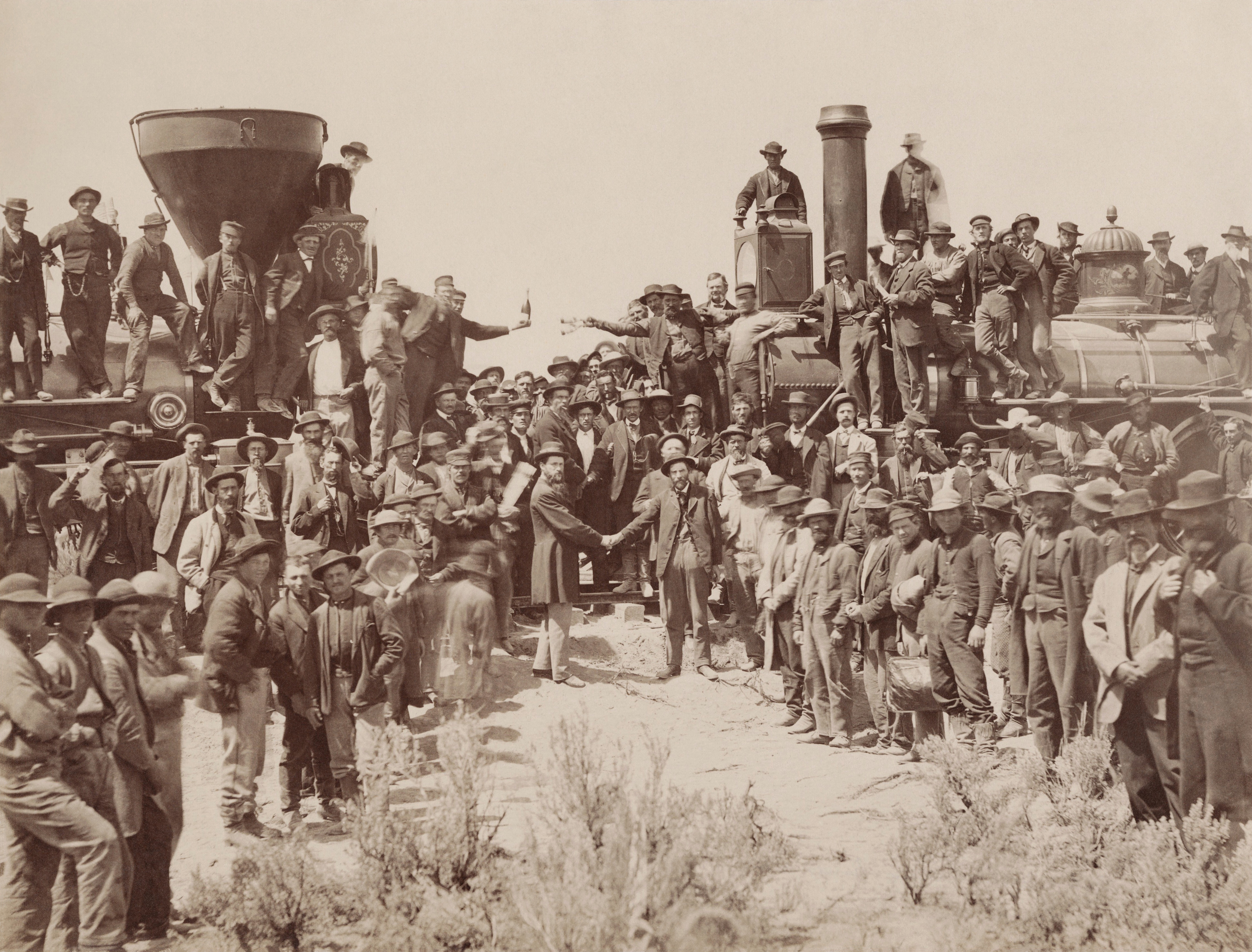 The May 1869 Golden Spike ceremony at Promontory Summit, Utah, celebrating the completion of the First Transcontinental Railroad.