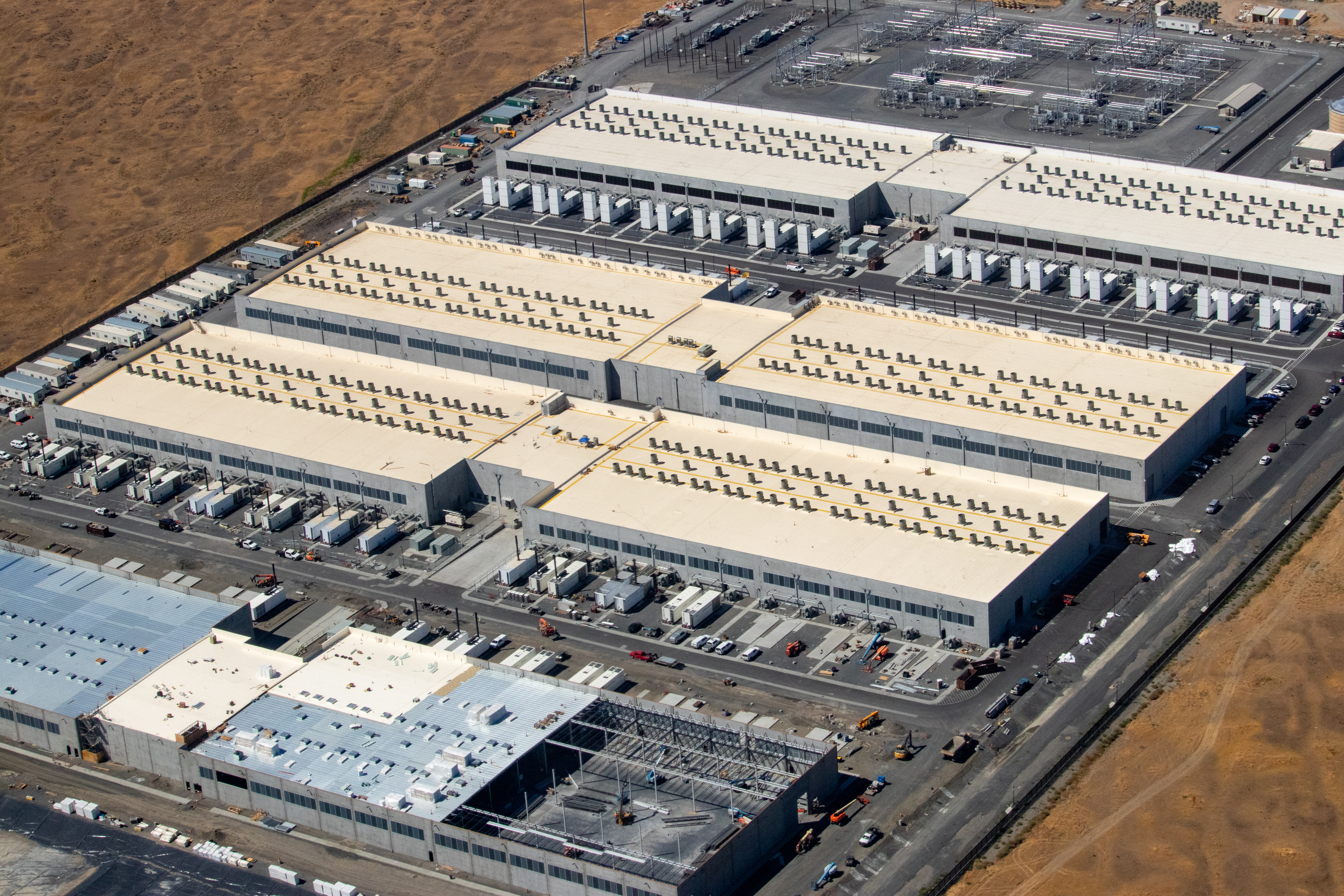 A physical view of an Availability Zone (AZ) in AWS's us-west-2 region, consisting of multiple discrete data centers. Transferring data between these physical locations incurs inter-AZ data transfer costs.