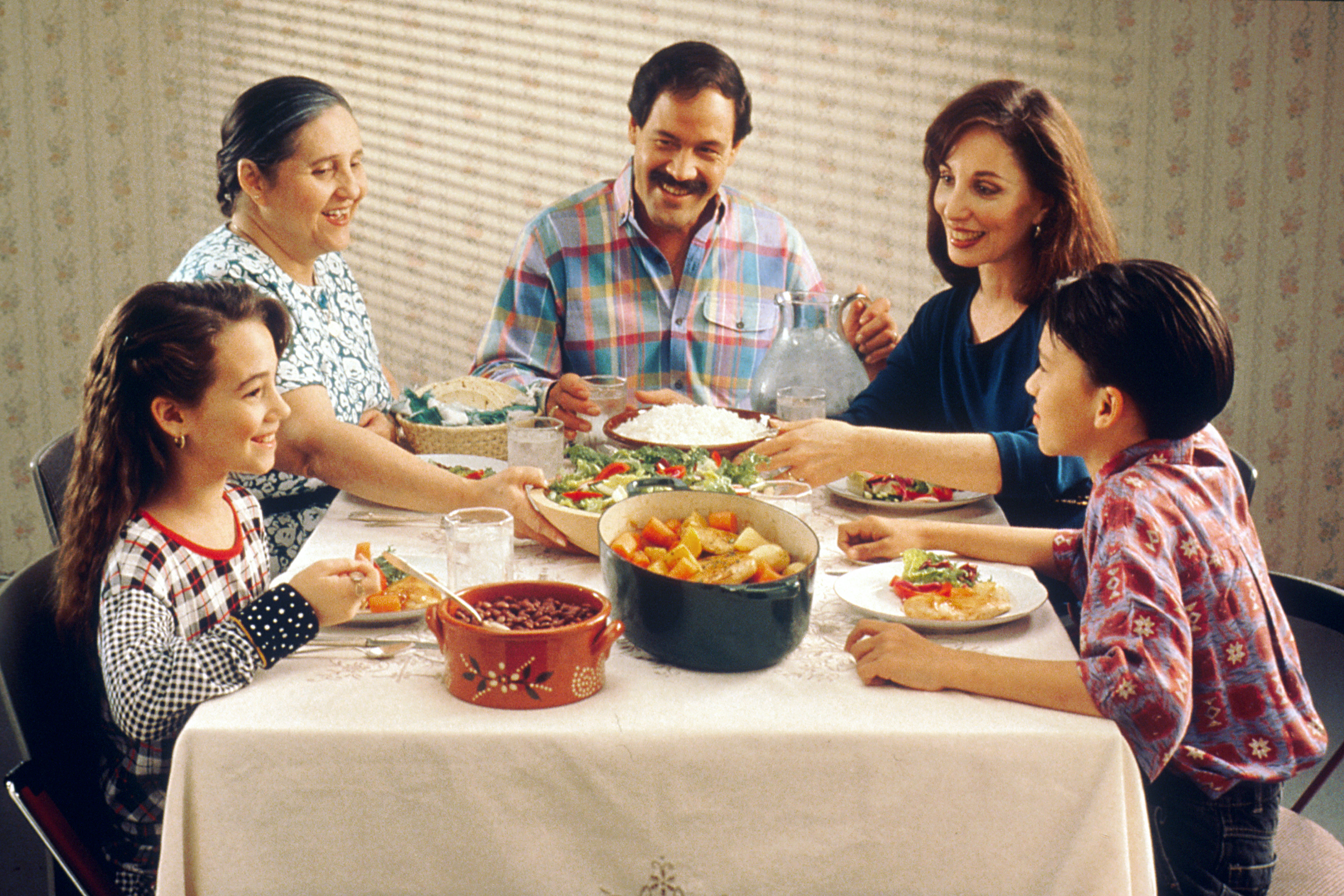 Families serve as the primary social unit where children first learn cultural norms and values before interacting with broader society.