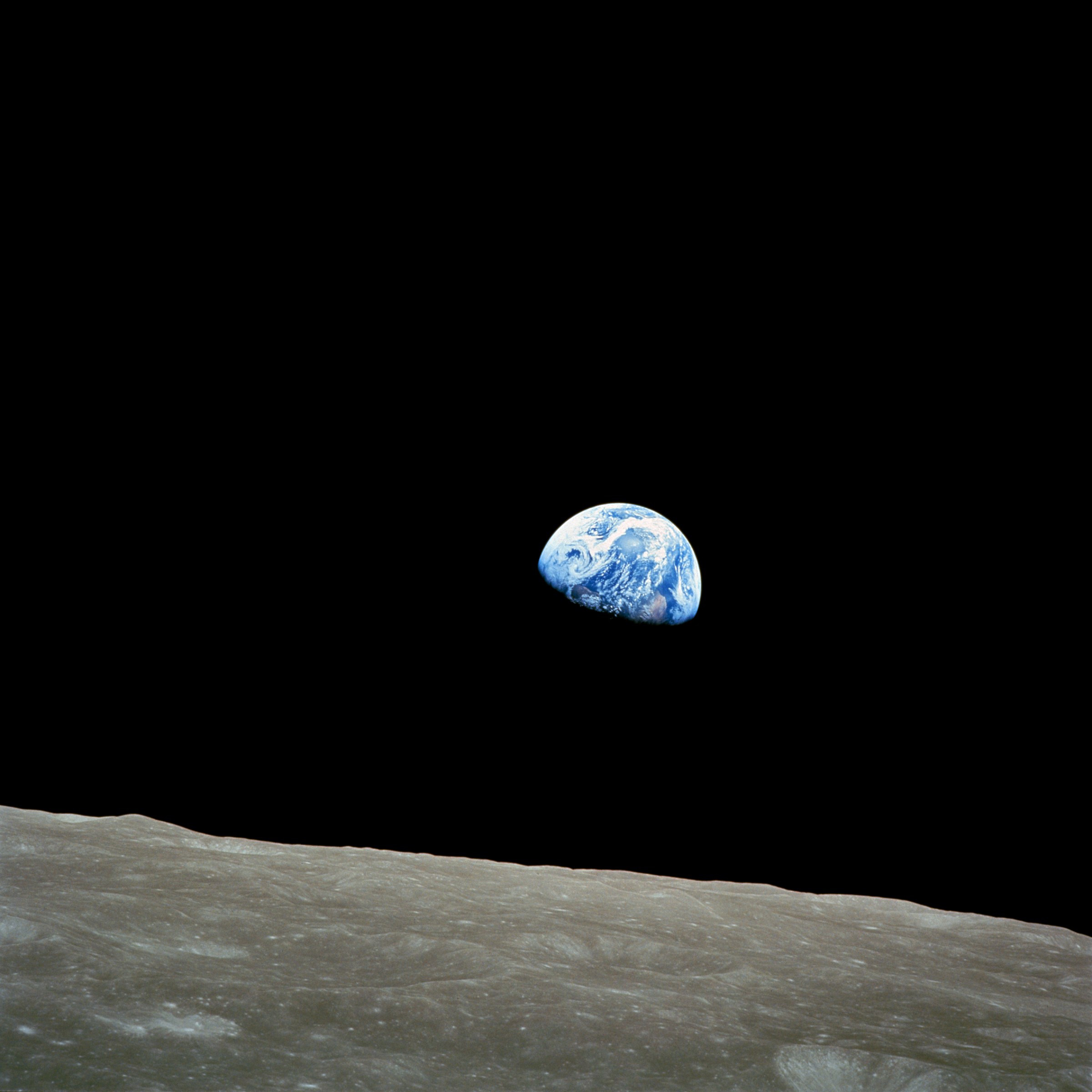 The famous "Earthrise" photograph taken during the Apollo 8 mission reminds students that Earth is a closed, interconnected system—often referred to as Spaceship Earth.