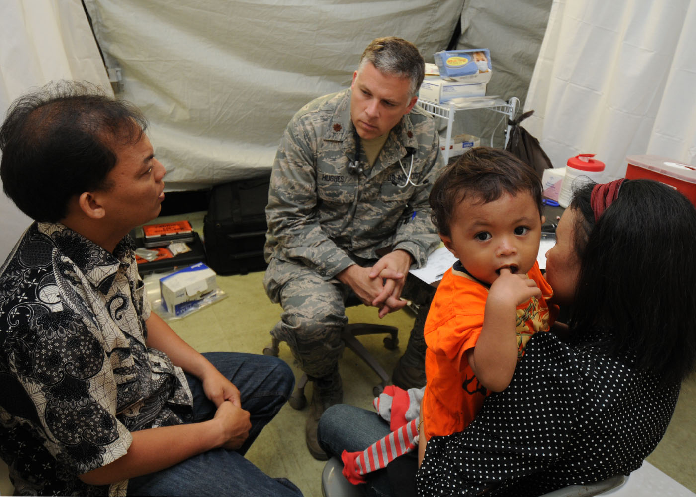A healthcare provider utilizes a trained medical interpreter to communicate with a patient, ensuring accurate medical translation and safeguarding the patient's autonomy.