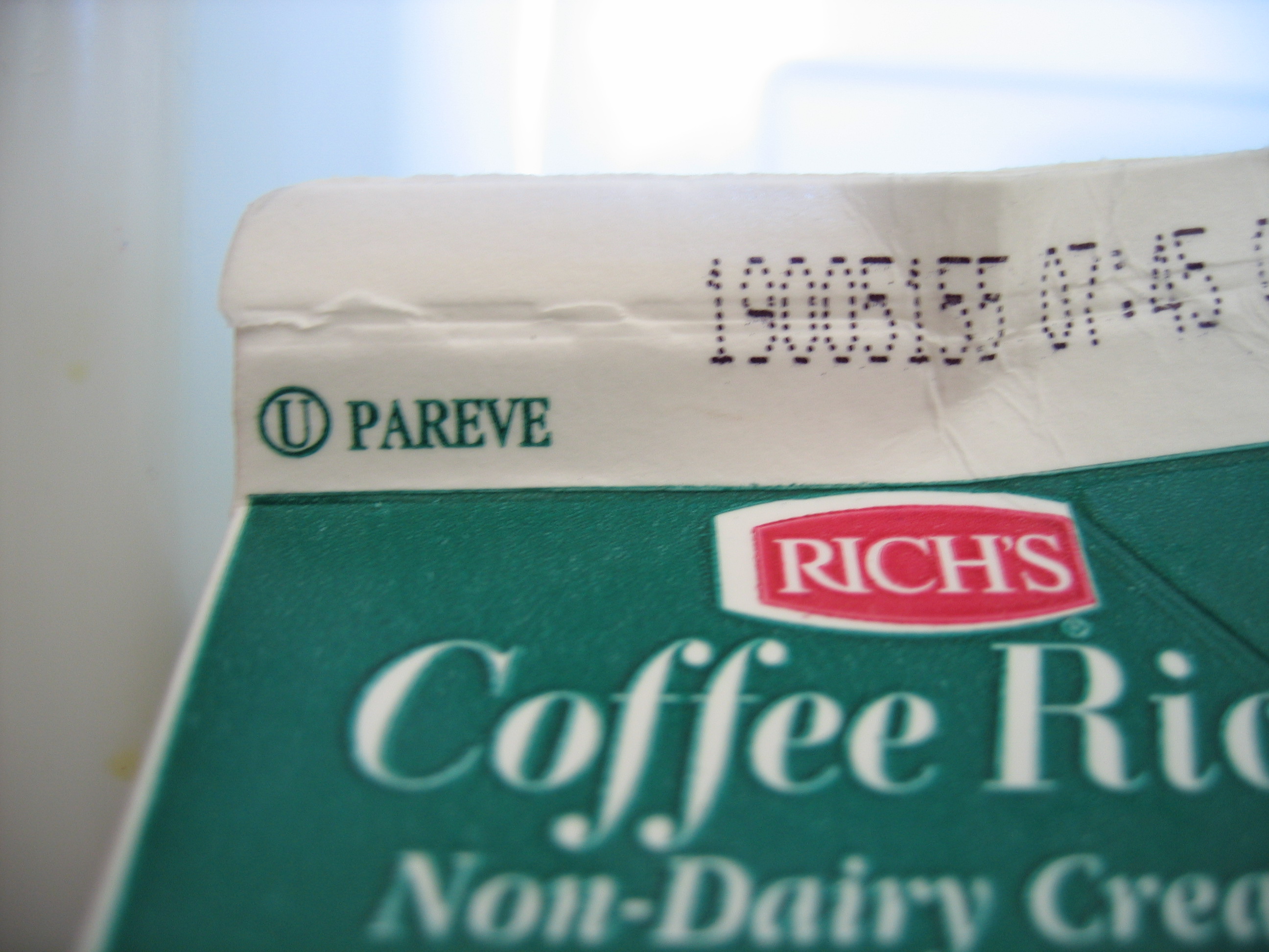 A standard Orthodox Union (OU) Kosher certification symbol. The 'Pareve' designation indicates the product is neutral and contains neither dairy nor meat ingredients, allowing it to be safely consumed under Kosher dietary laws.