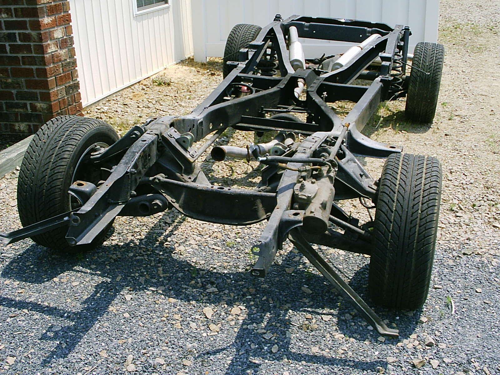 Self-managing a database on an EC2 instance is akin to building a vehicle from a bare chassis, requiring the customer to supply and maintain the operational "engine" themselves.