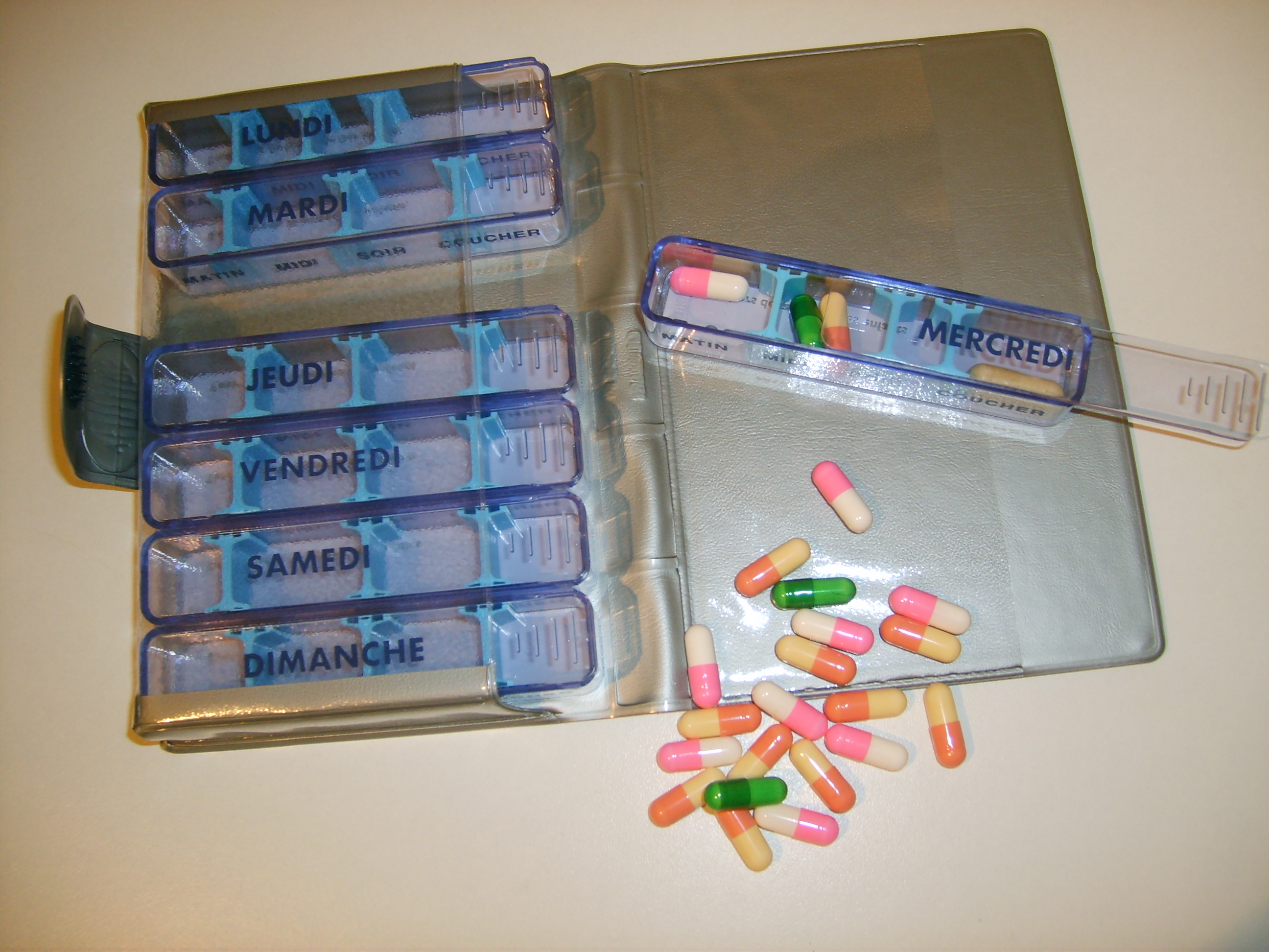 A multi-compartment pill organizer, a simple but highly effective intervention for managing complex daily medication schedules and improving patient adherence.