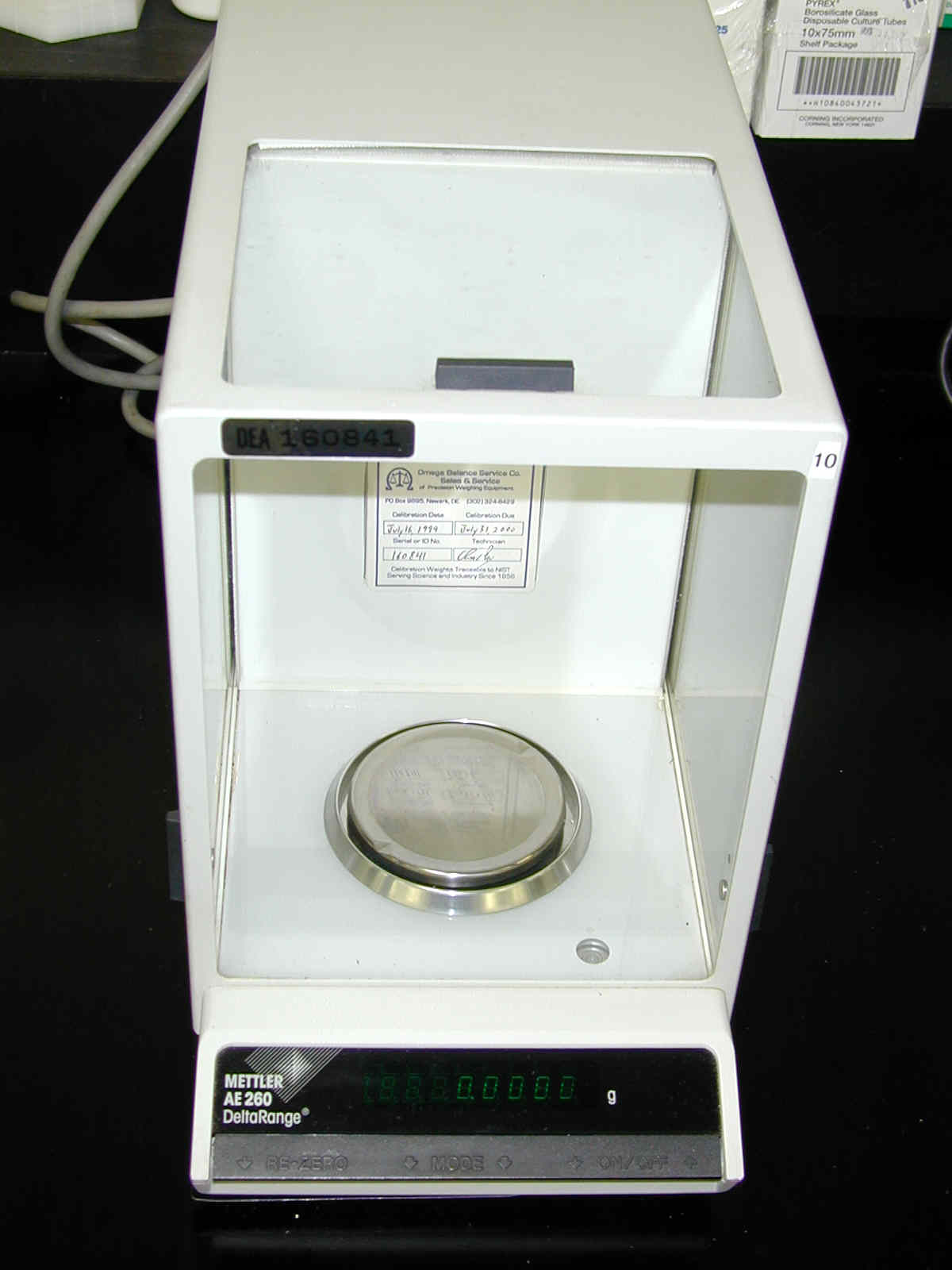A digital analytical balance provides highly precise mass measurements, often down to the sub-milligram level, and is standard in modern biochemical laboratories.