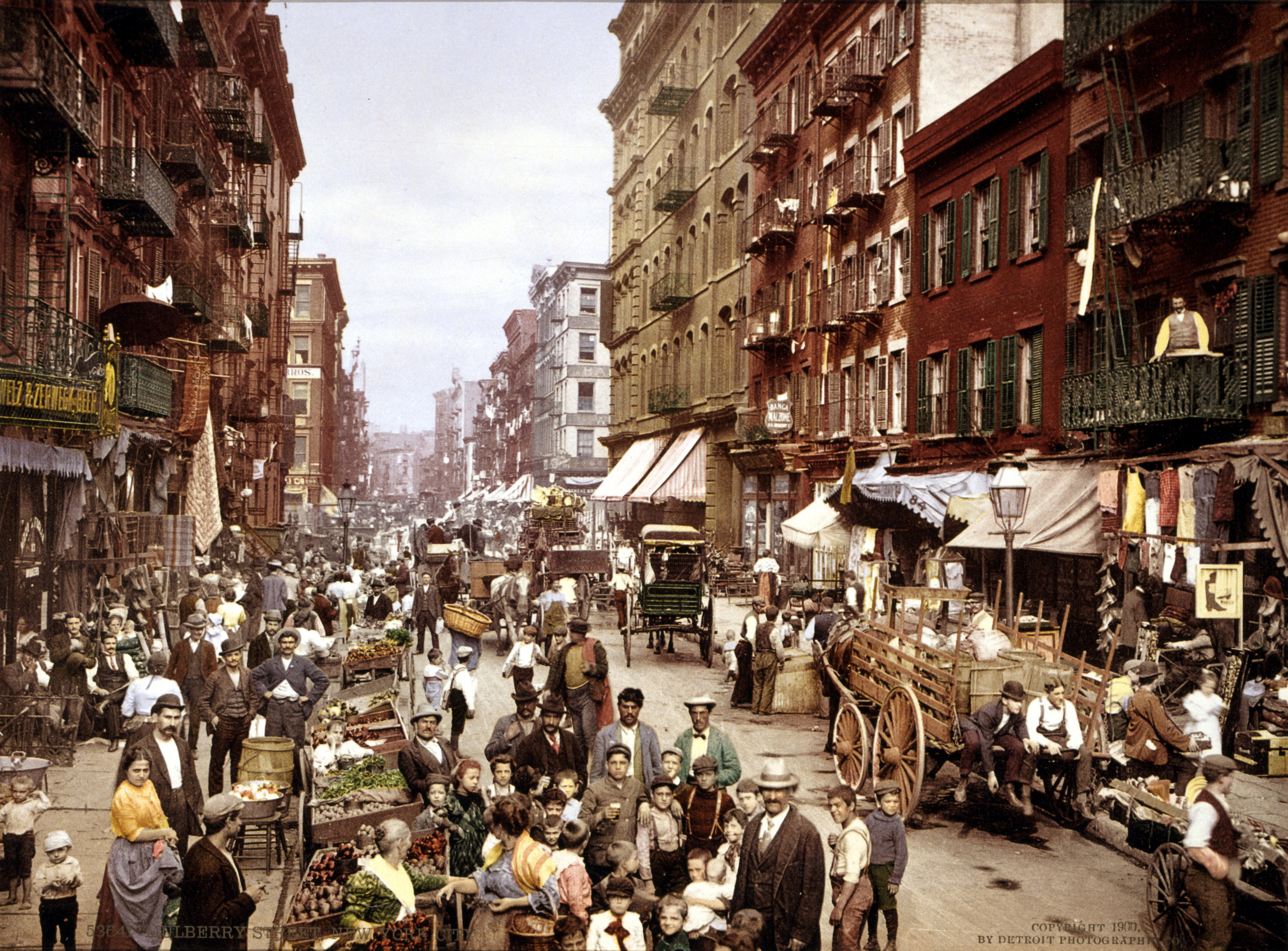 Mulberry Street in Manhattan's Little Italy (c. 1900), a classic example of an ethnic enclave providing mutual support networks for new arrivals.