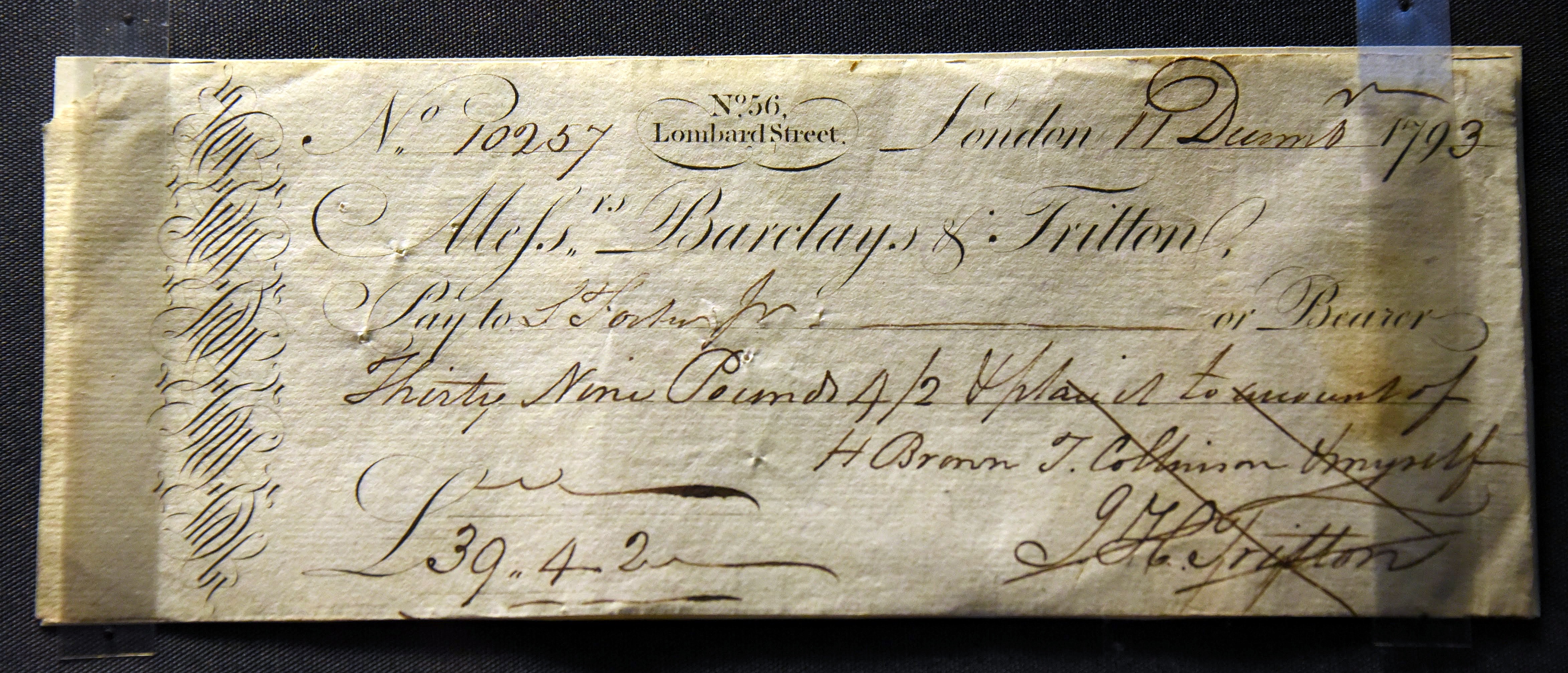 A historic English cheque, issued in London — the kind of payment instrument a client might use to send a single mixed payment covering both a disbursement and money on account of costs.