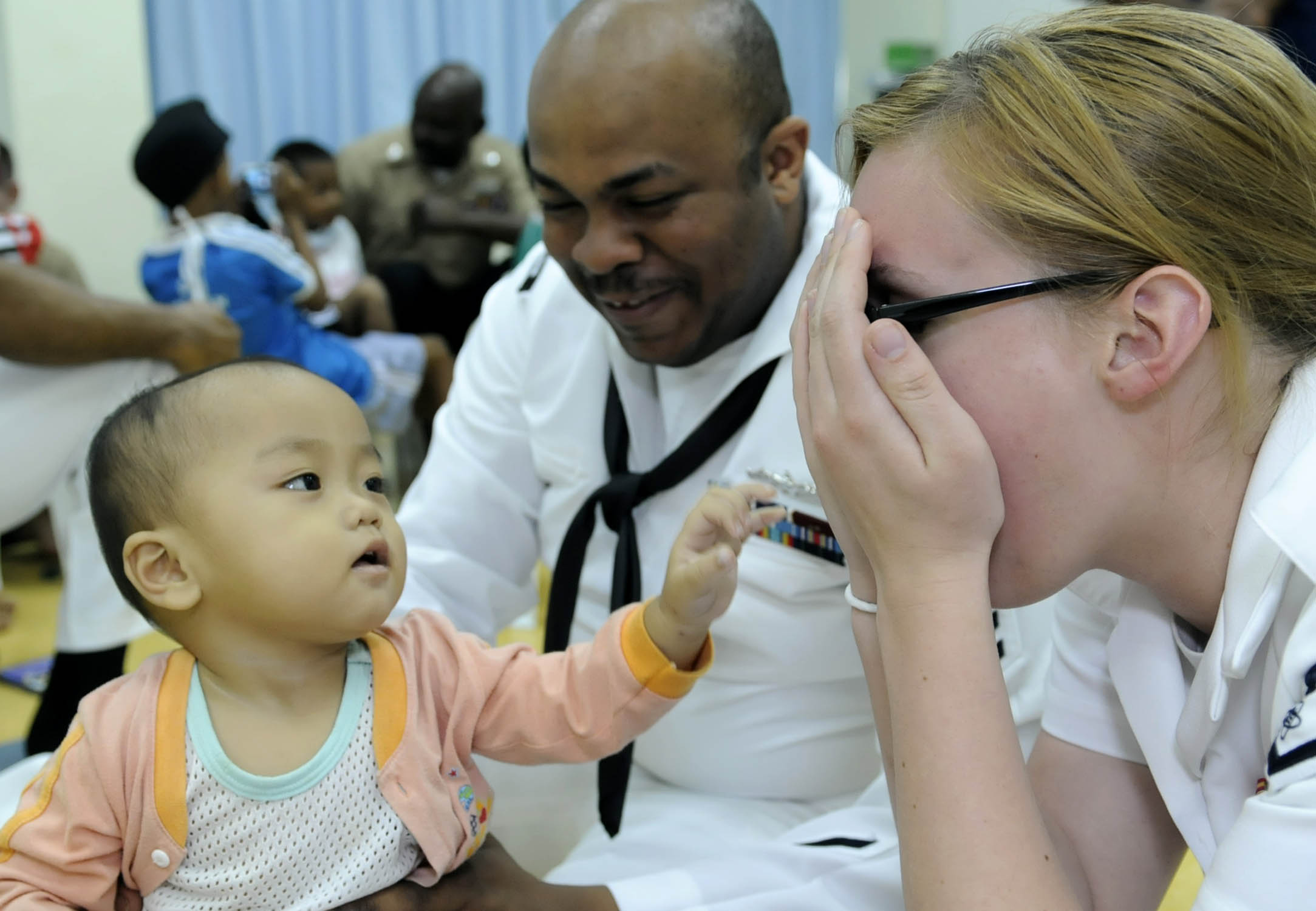 Games like peek-a-boo help test an infant's development of object permanence, a critical cognitive milestone during Piaget's sensorimotor stage.