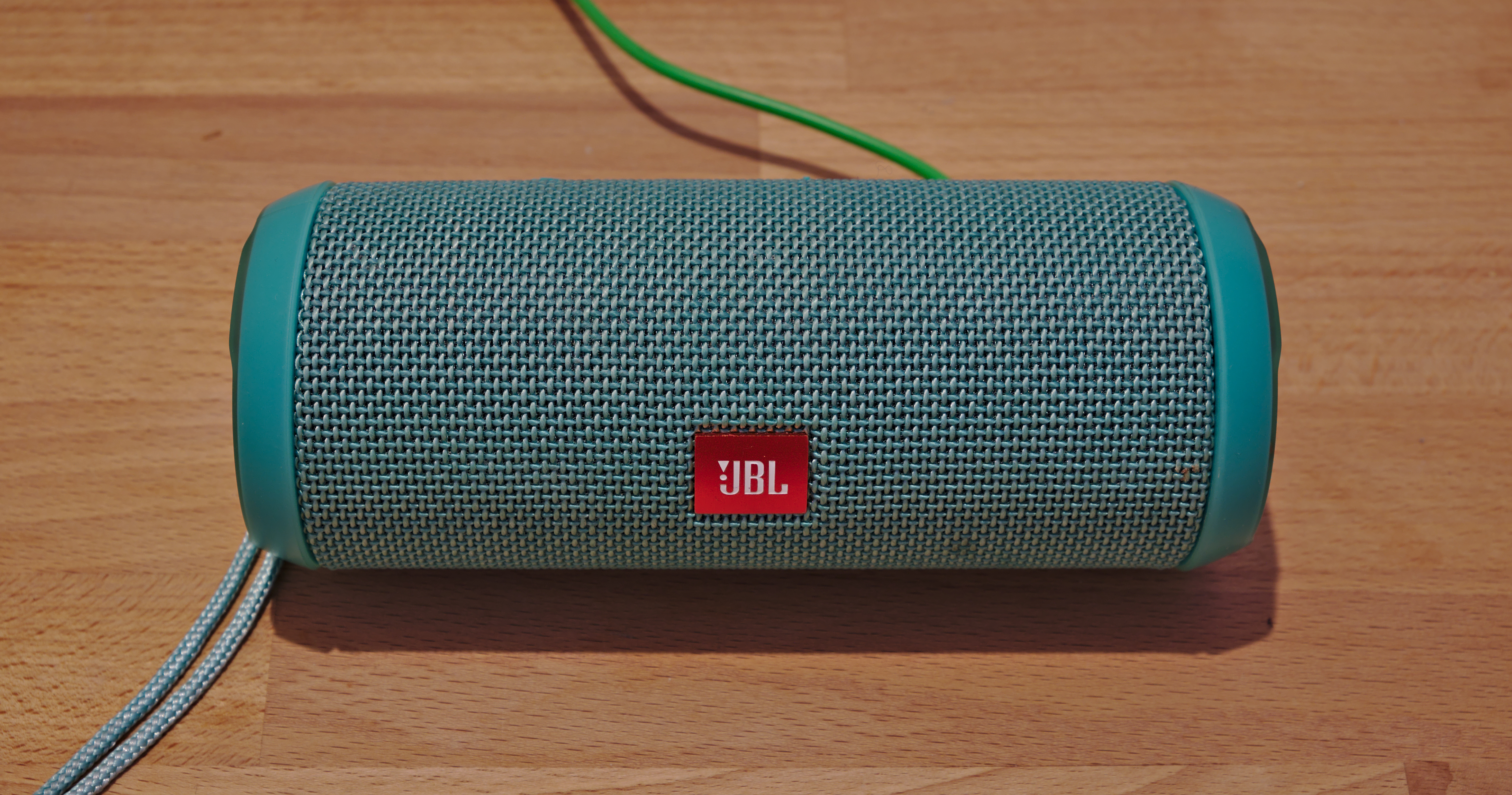 Age-appropriate instructional materials, such as a Bluetooth speaker, provide functional ways to teach foundational concepts like cause-and-effect to older students while preserving their social dignity.