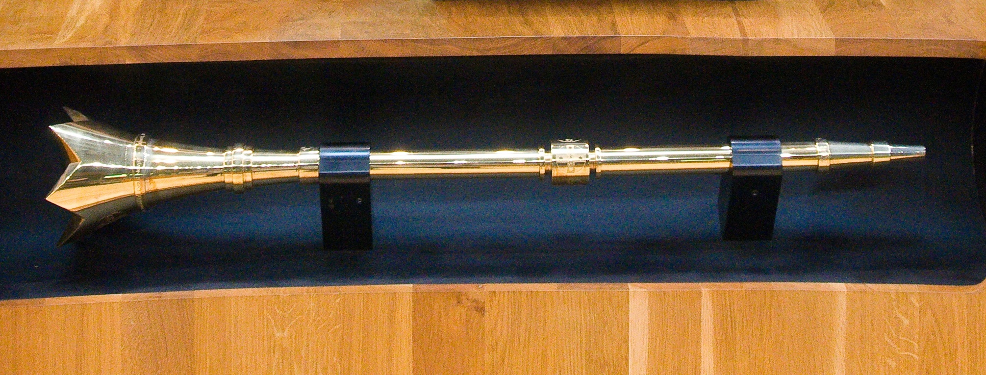 The Senedd's ceremonial mace, Byrllysg, which sits before the Presiding Officer during debates — the formal symbol of the Senedd's authority to legislate through the four stages described here.