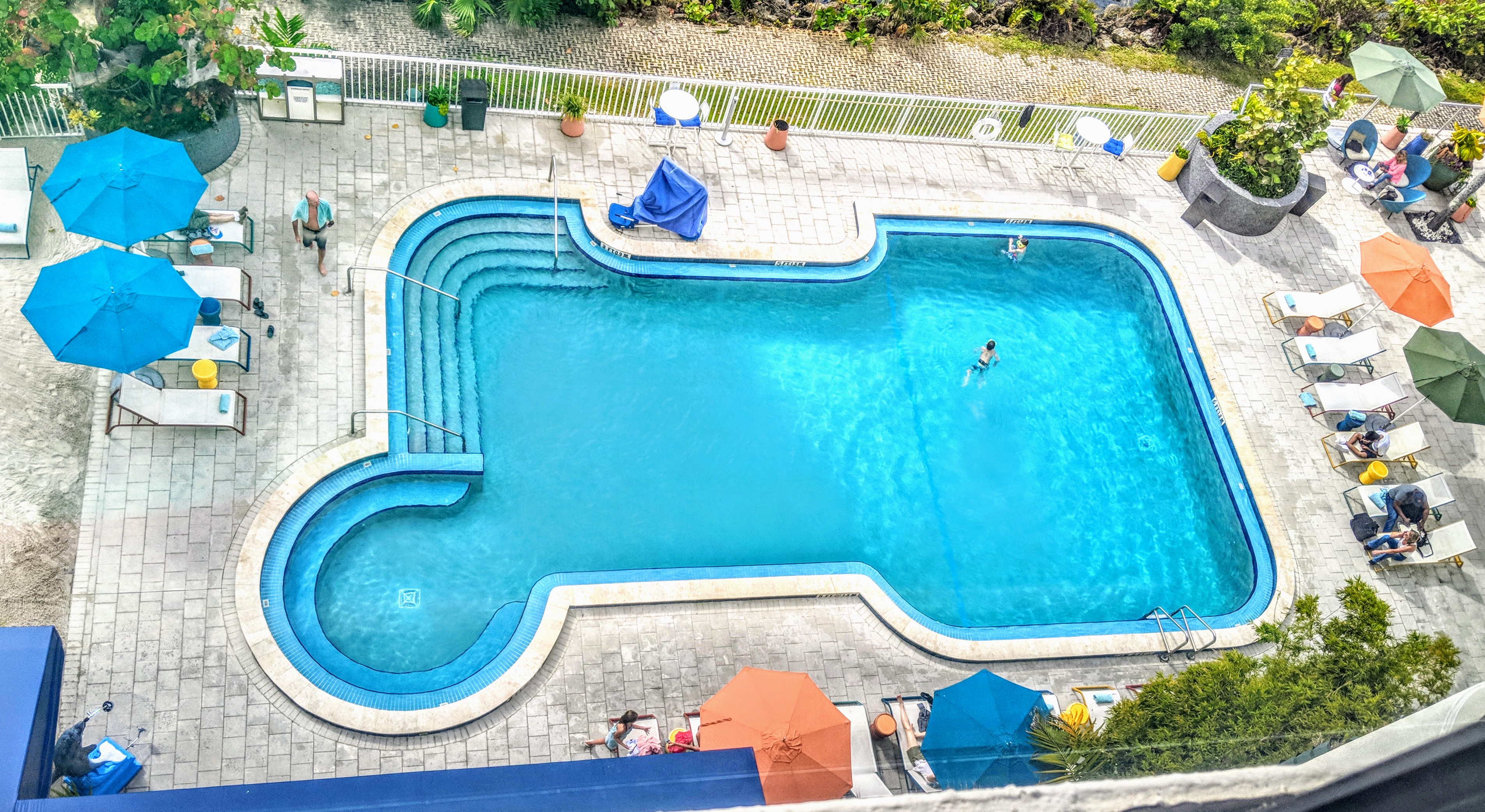An outdoor swimming pool — the type of premises in Ratcliff v McConnell, where an adult trespasser who dived in at night was held to have willingly accepted an obvious risk.