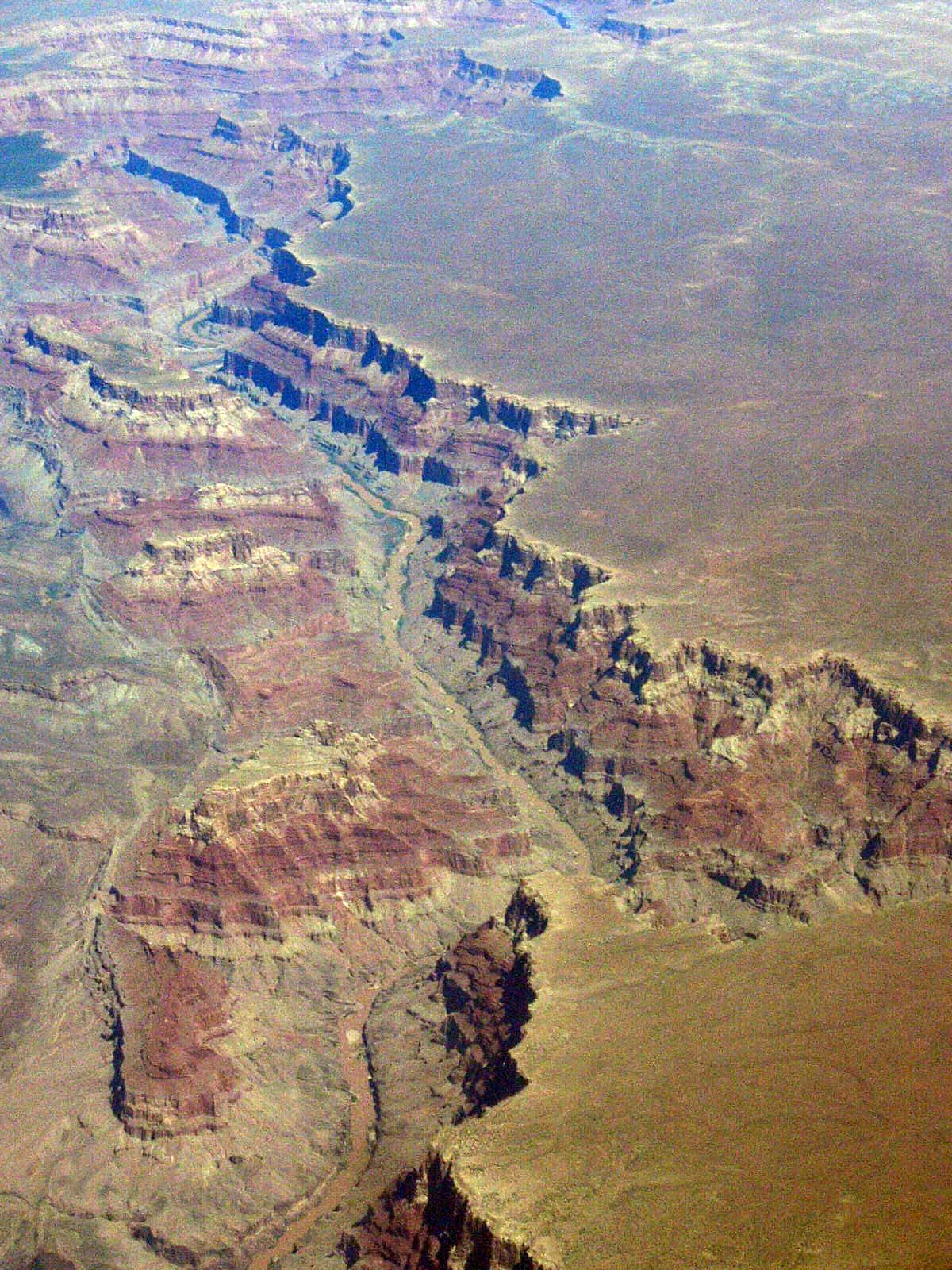 The Grand Canyon is a monumental example of slow geological change, carved grain by grain by the erosive power of the Colorado River over millions of years.