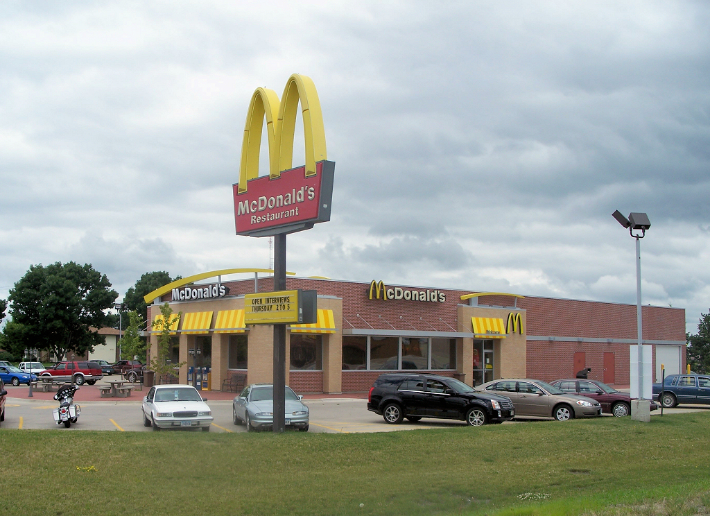McDonald's Corporation, a familiar example of a registered company — a legal person entirely distinct from the individuals who own or run it.