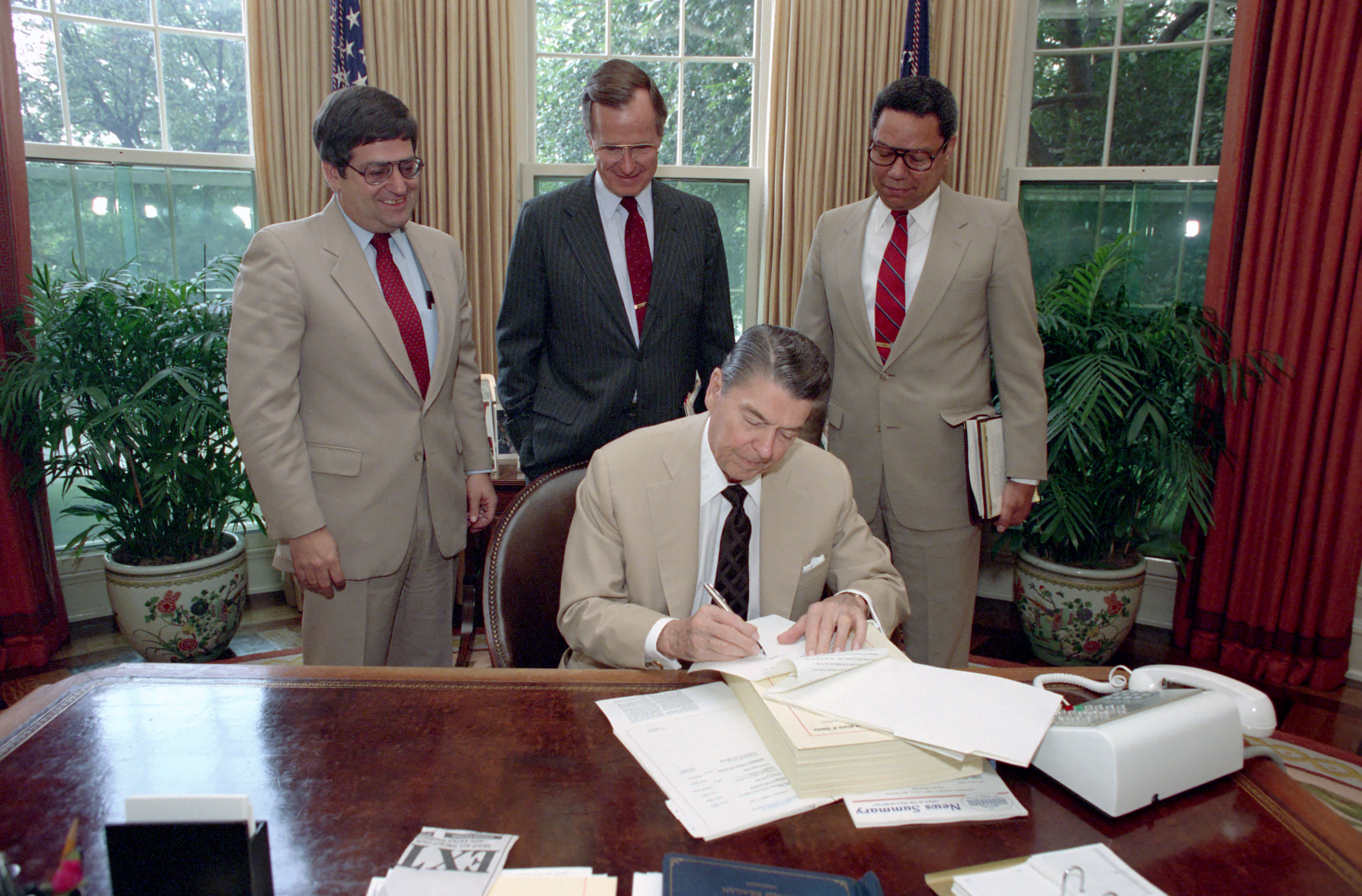 President Ronald Reagan signing a veto. The presidential veto serves as a primary executive check on the legislative branch's power to create laws.
