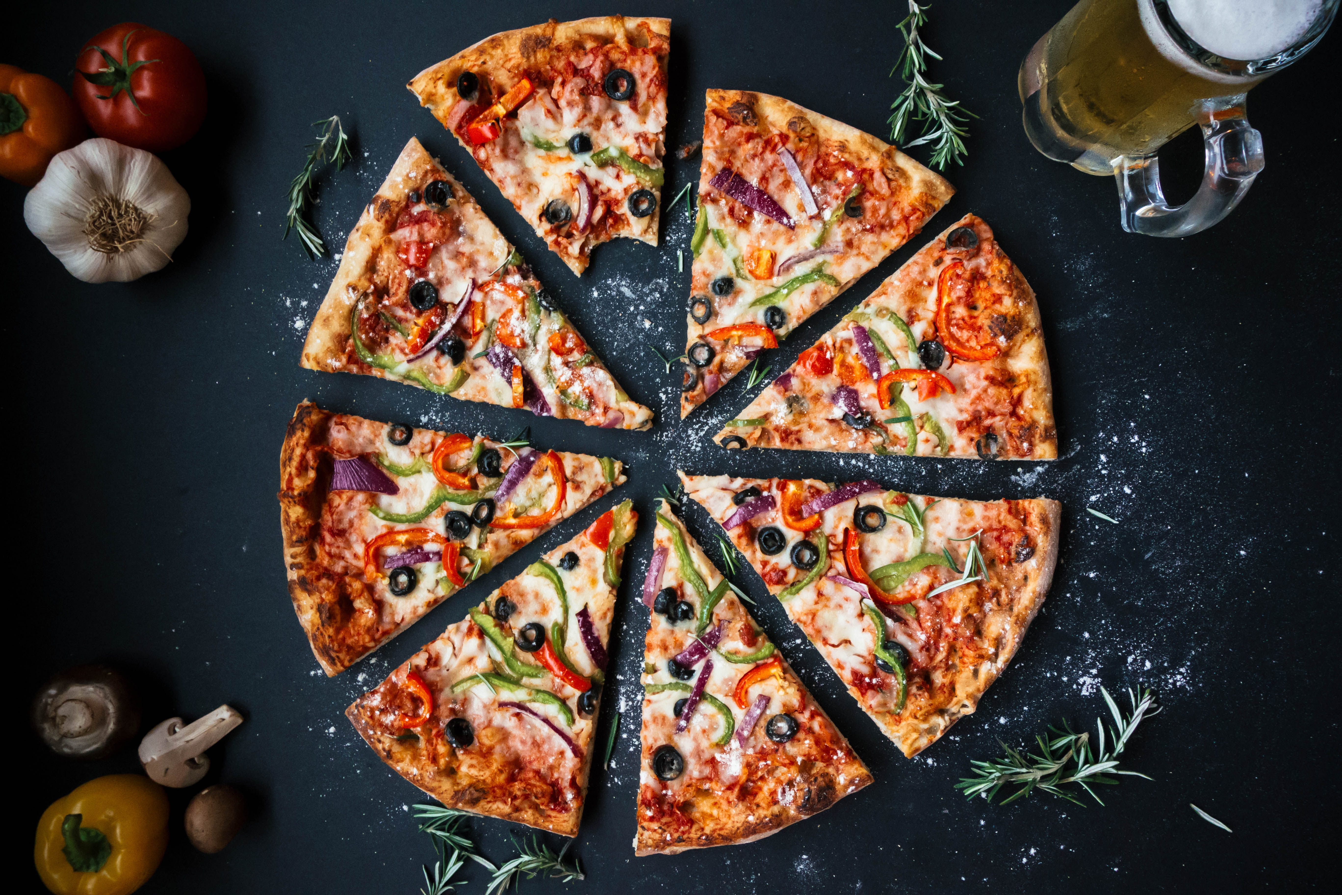 A sliced pizza demonstrates how fractional parts must always relate to a specific whole; stating a fraction without defining its referent whole leaves the physical quantity ambiguous.