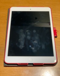 Fingerprint smudges clearly visible on a touchscreen demonstrate the physical vulnerability of swipe patterns. Attackers can deduce the unlock shape by reading the oily residue left by the user's finger.