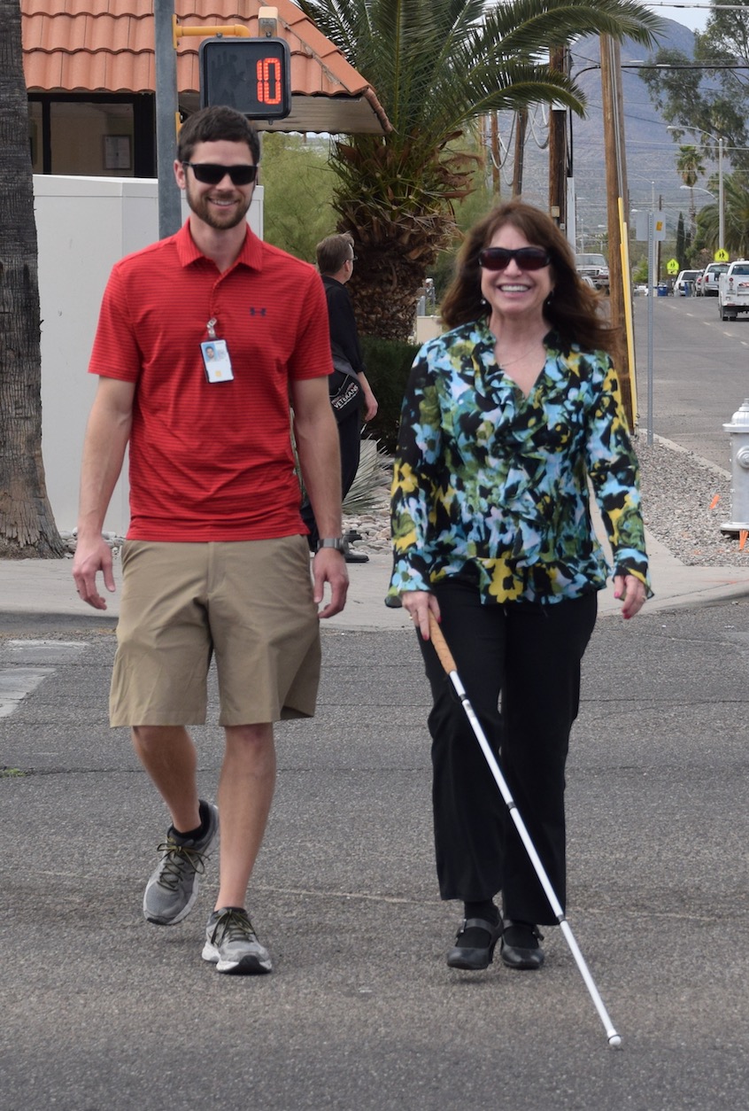 Orientation and Mobility (O&M) specialists teach students with visual impairments how to safely navigate their environments using tools like a long white cane.