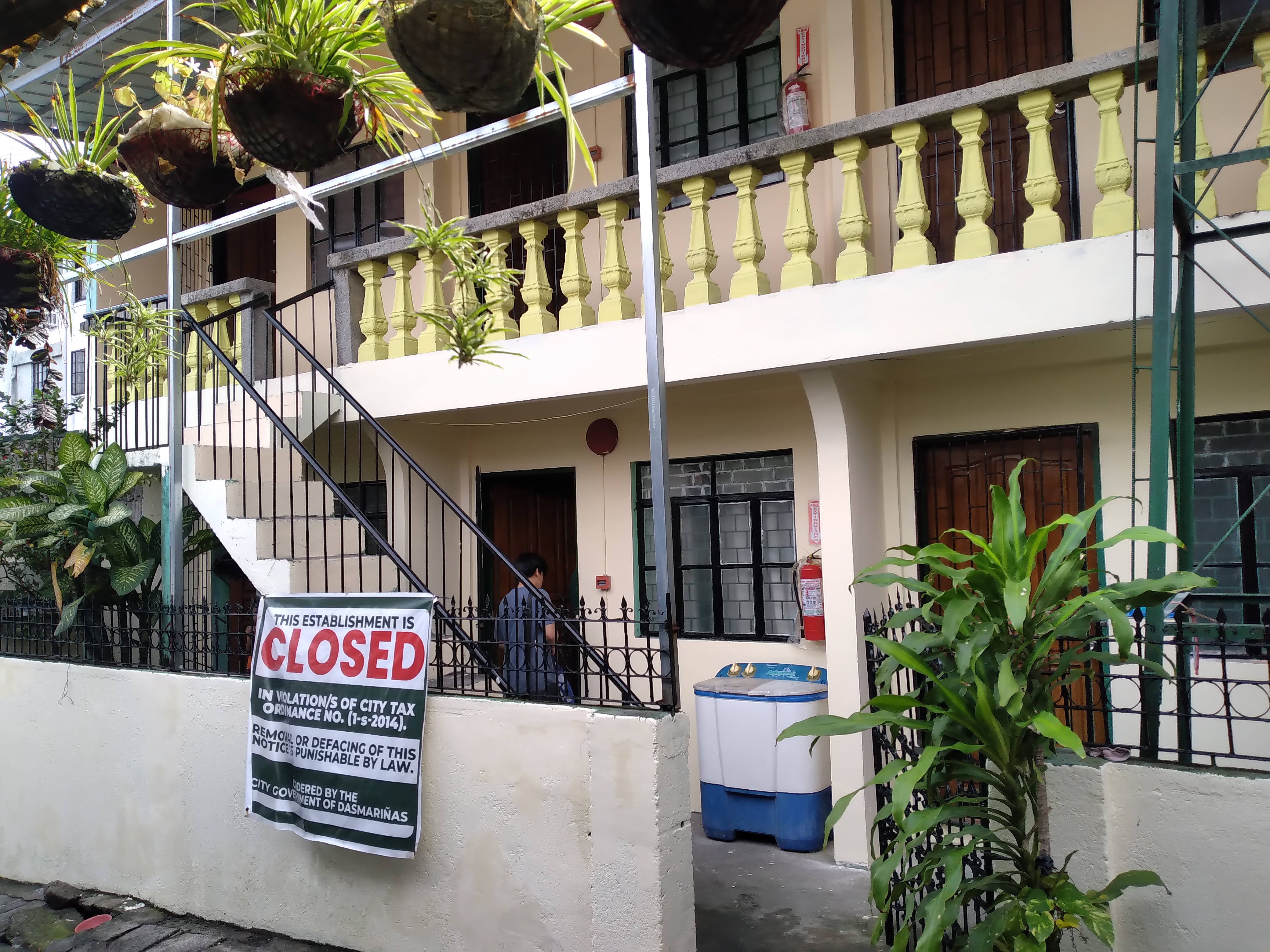 An apartment building closed due to property tax arrears. Because general obligation bonds are backed by ad valorem taxes, the municipality's ability to assess and legally enforce real estate taxes is paramount to bondholder safety.