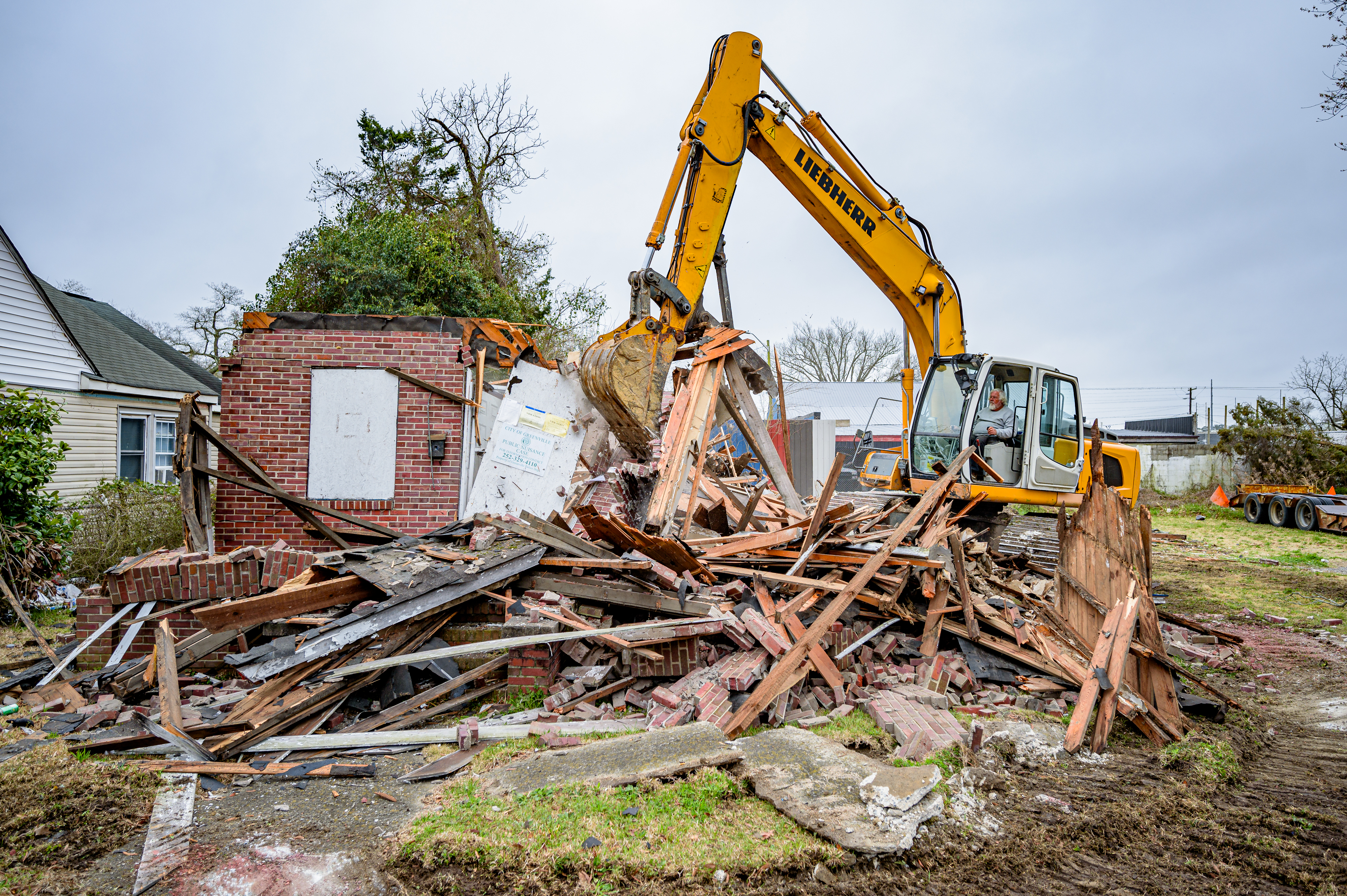 When an existing structure becomes entirely obsolete and the underlying raw land is worth more than the currently improved property, the highest and best use is financially justified demolition.