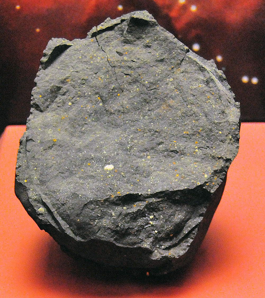 A sample of the Murchison meteorite, which contains over eighty naturally occurring amino acids, providing physical evidence that the abiotic synthesis of organic compounds occurs in space.