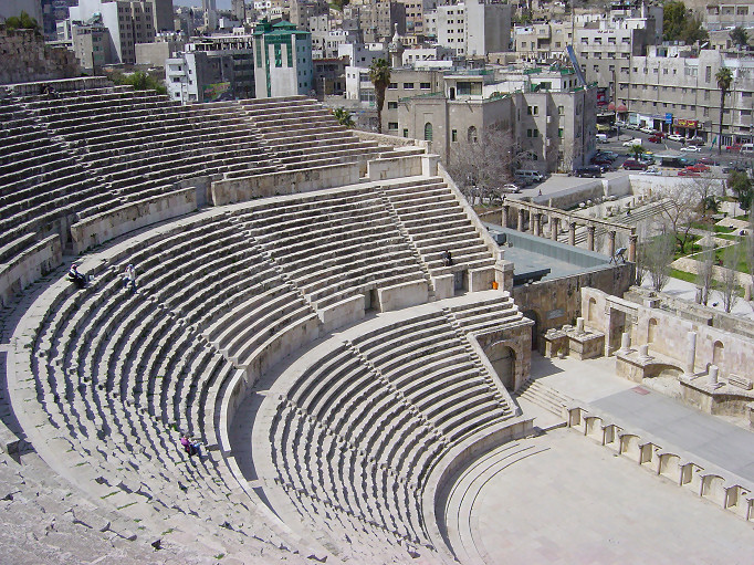 An ancient Roman theatre in Amman, Jordan. When writing a speech, an author must structure their pacing and delivery to accommodate the physical and acoustic realities of the space where the text will be presented.