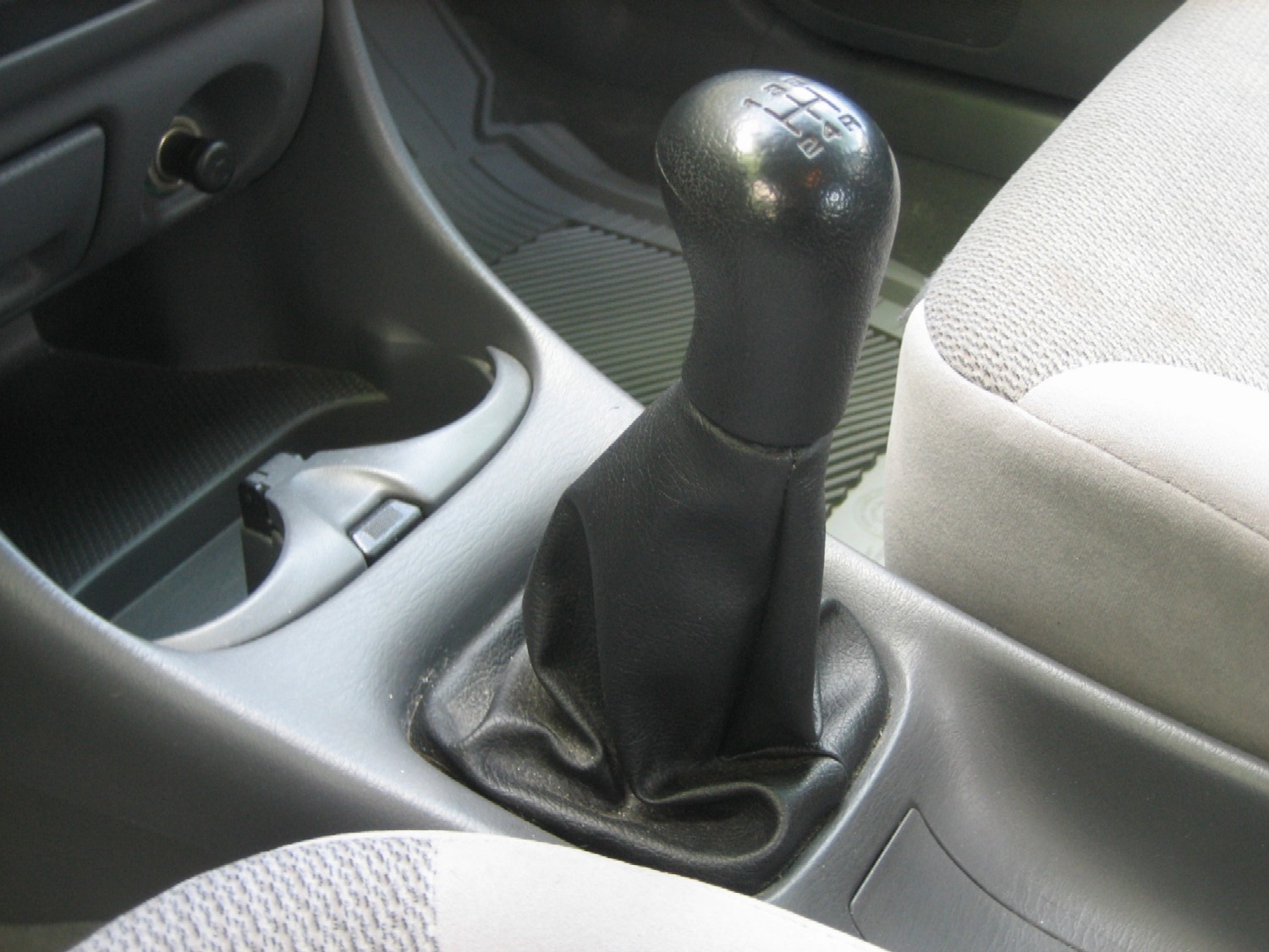 Learning to read is cognitively similar to driving a manual transmission: initially, mechanical tasks like shifting gears consume all available working memory, leaving no capacity for higher-level navigation.
