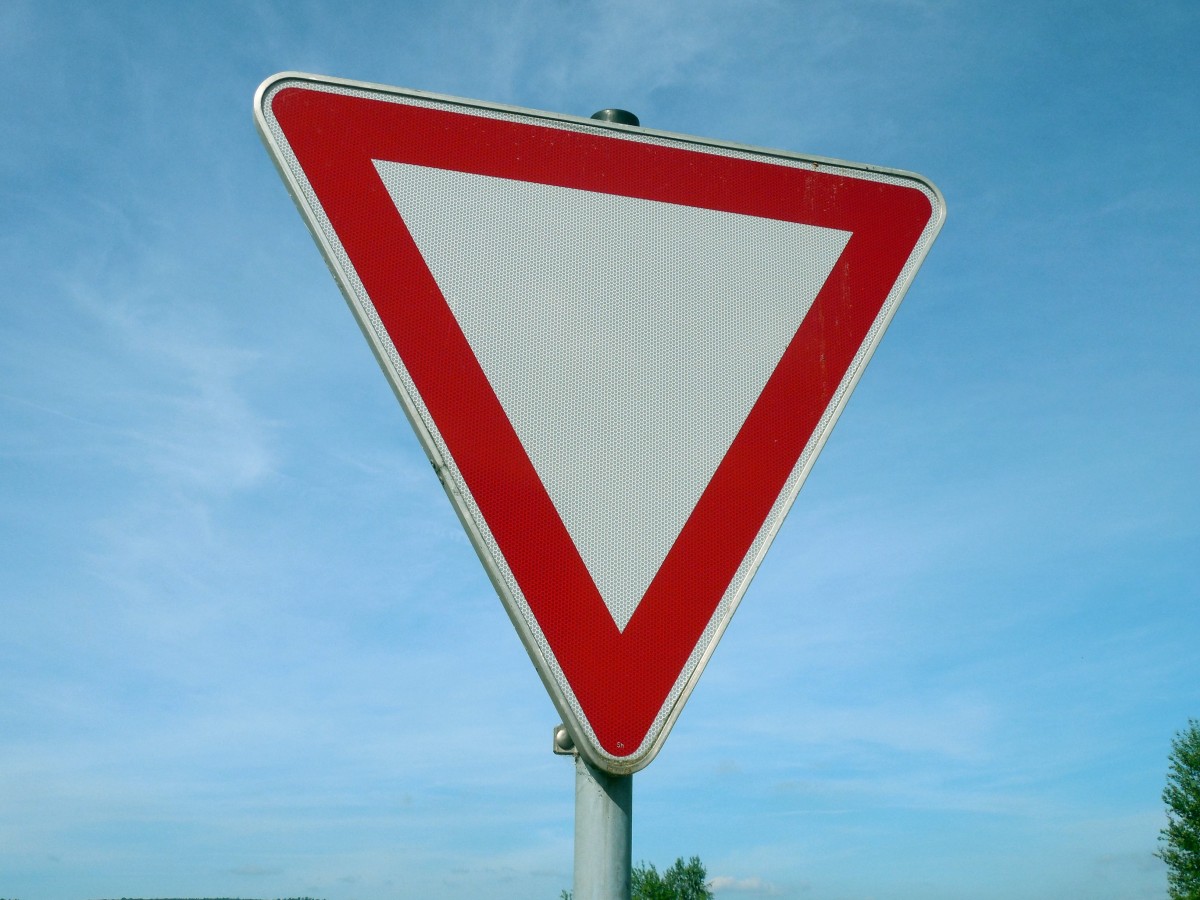 A physical yield sign provides an excellent real-world example of Angle-Angle-Angle (AAA) similarity: any yield sign, regardless of its physical size, shares the same internal angle measures.