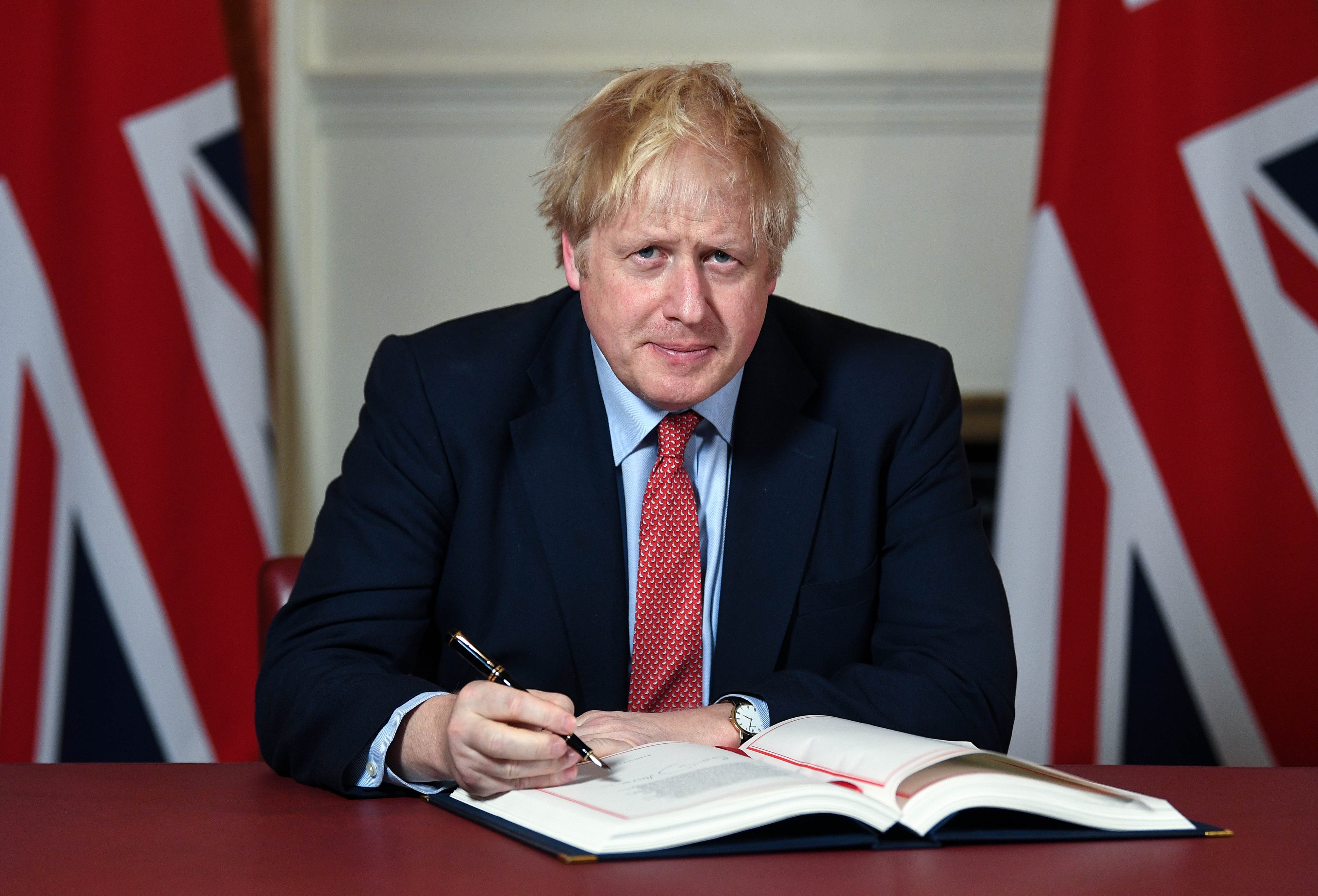Prime Minister Boris Johnson signs the Brexit withdrawal agreement in 2020, the process leading to the European Communities Act 1972 being repealed on exit day and EU law converted into domestic retained EU law.