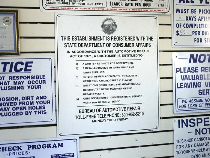 Consumer protection laws frequently mandate the public posting of legal declarations, similar to this California automotive repair notice. New York's Fair Housing Notice operates on this same principle of passive public transparency.