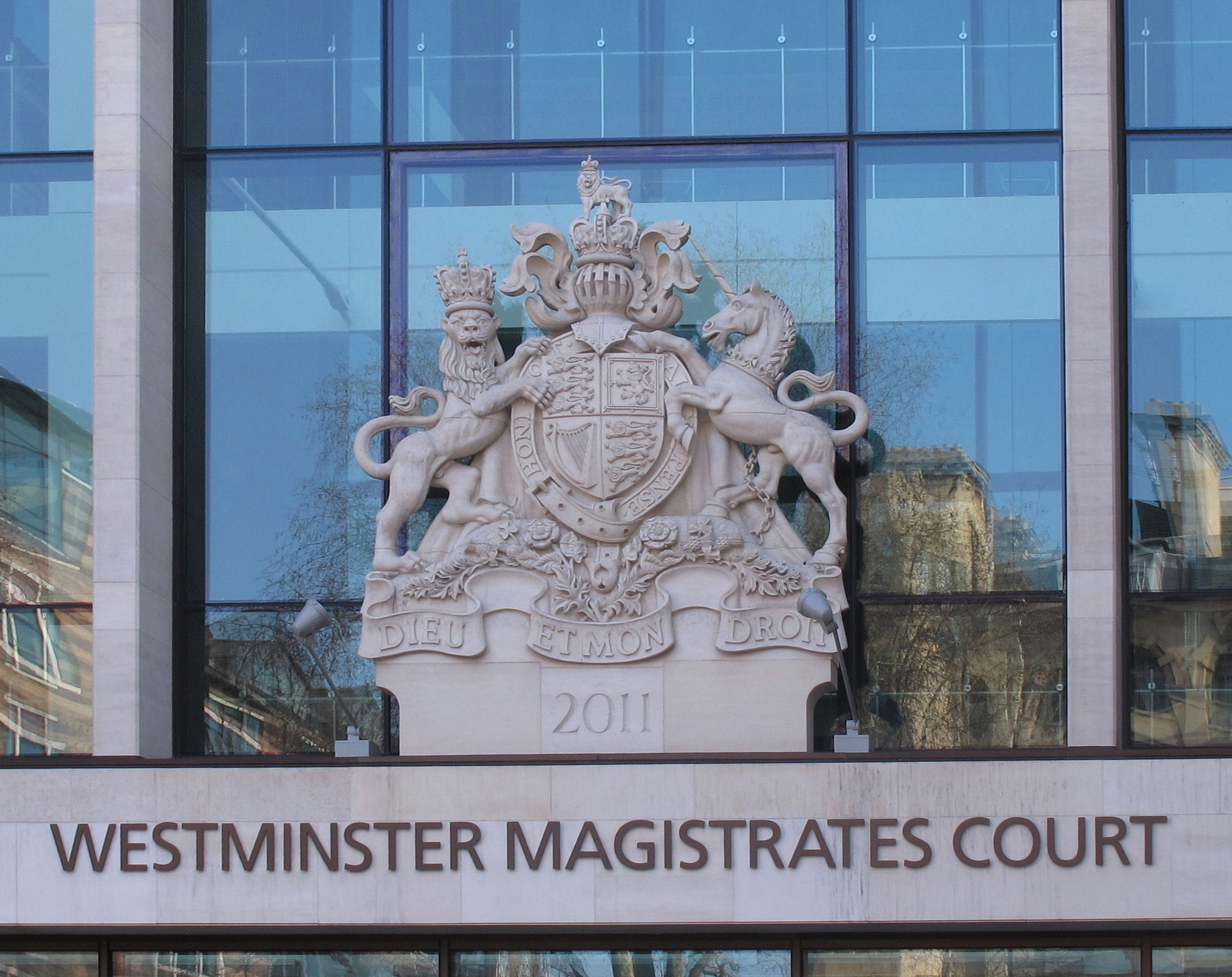 The royal coat of arms on an English court building, symbolising the Crown's legal authority — the ultimate recipient of an intestate estate as bona vacantia once every statutory class of relative is exhausted.