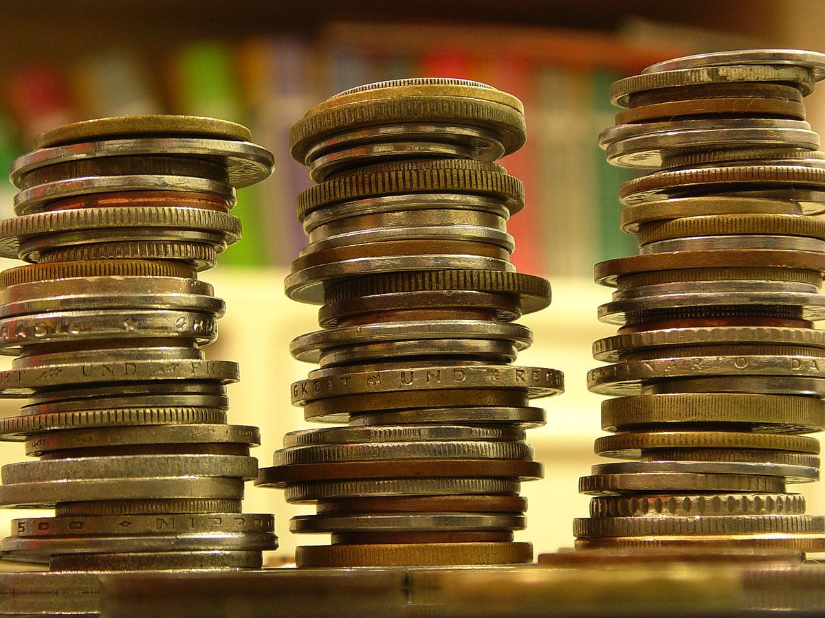 When sorting a handful of mixed coins, we naturally apply mathematical properties to efficiently group and combine compatible values.